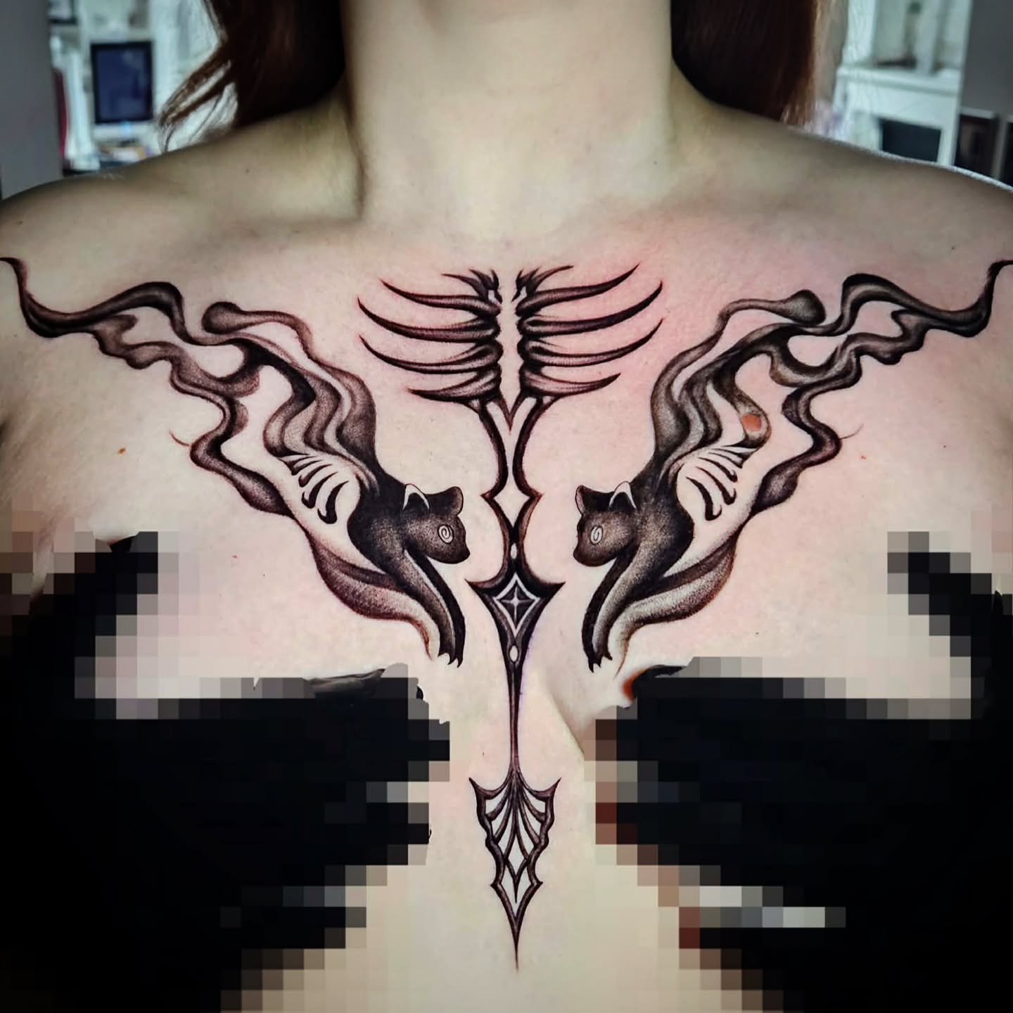 Cat and bird geometric tattoo on the back by Isaac Morales