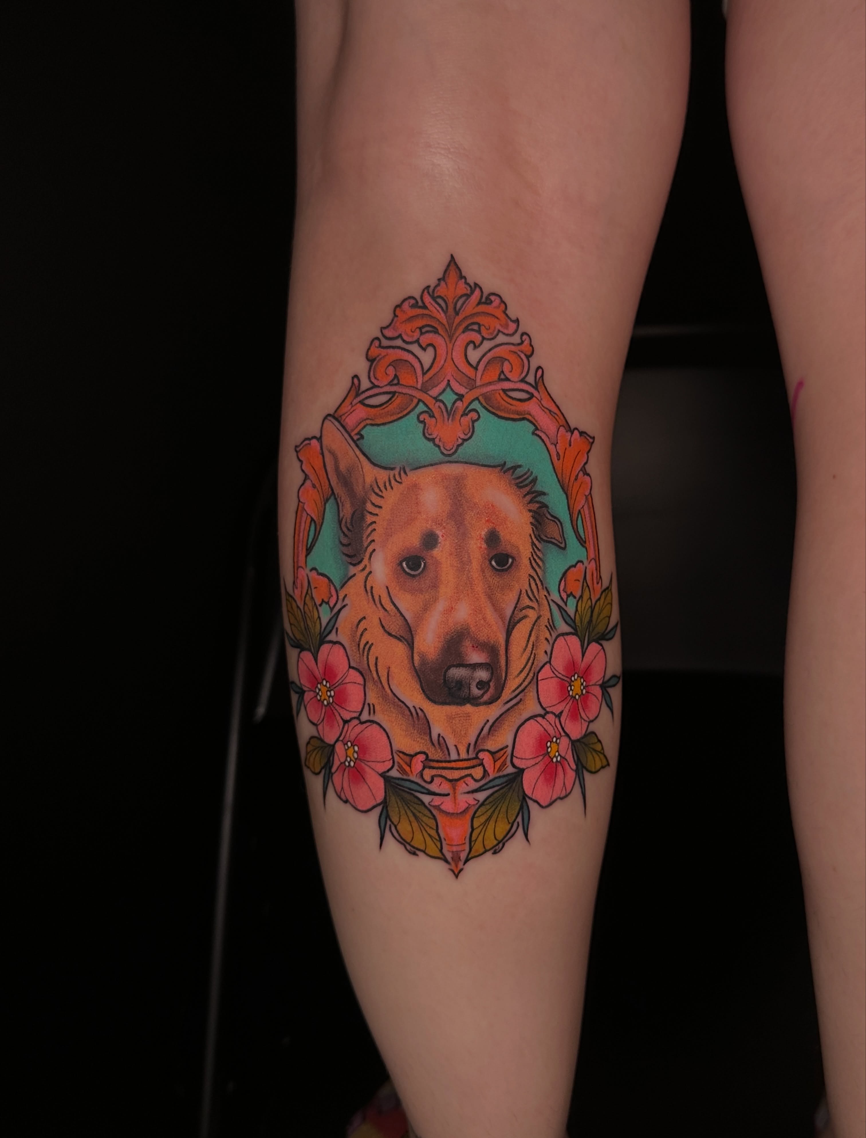 Dog with floral frame realism tattoo on the forearm by ⊹₊⟡⋆ 𝕵𝖔𝖎𝖊 ⊹₊⟡⋆