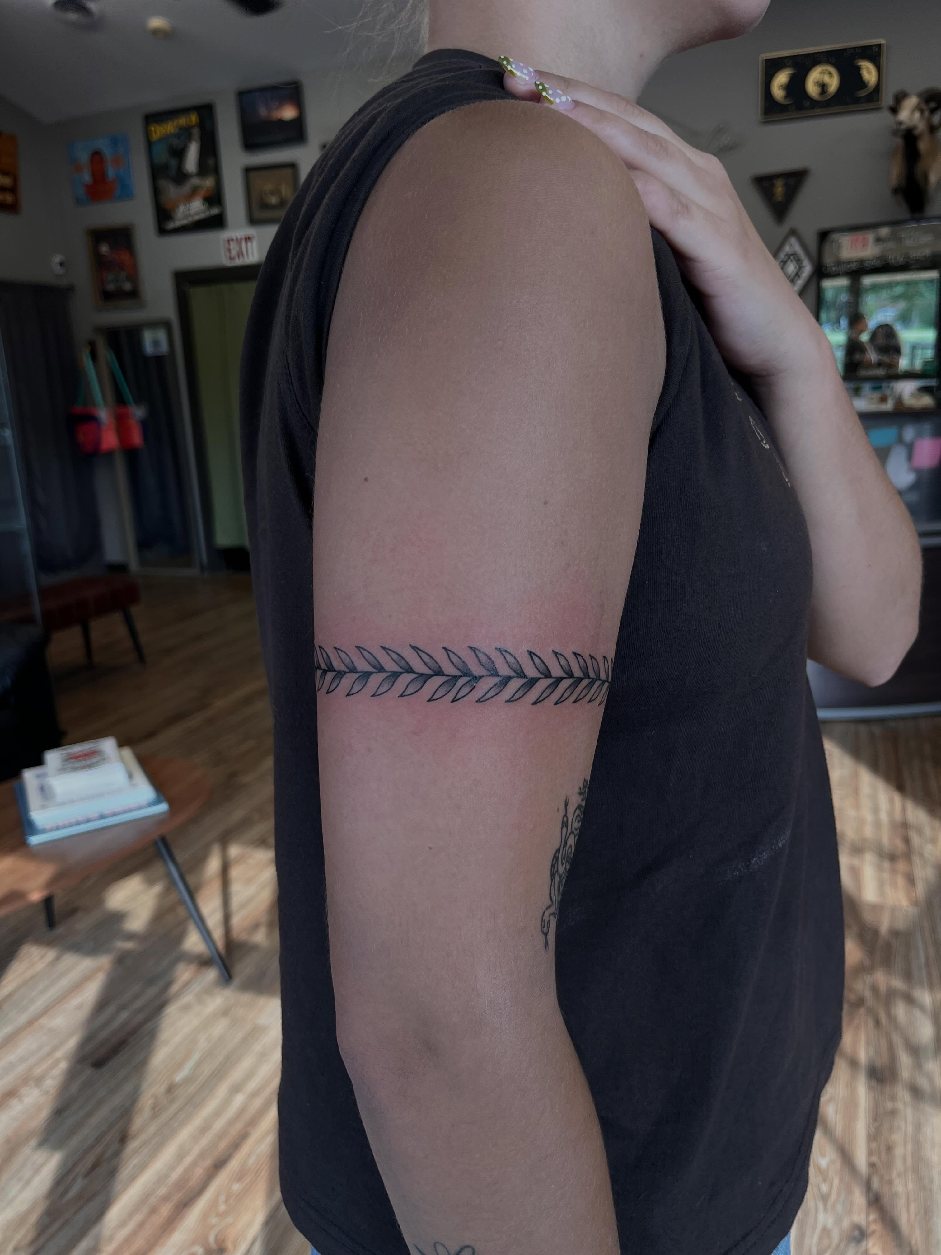Arrow geometric tattoo on the forearm by Cass