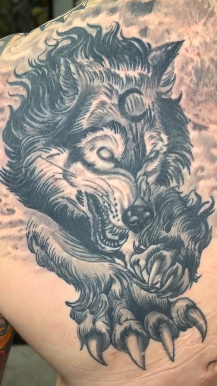Wolf with moon background realism tattoo on the back by Rafael Marte, White Plains, New York