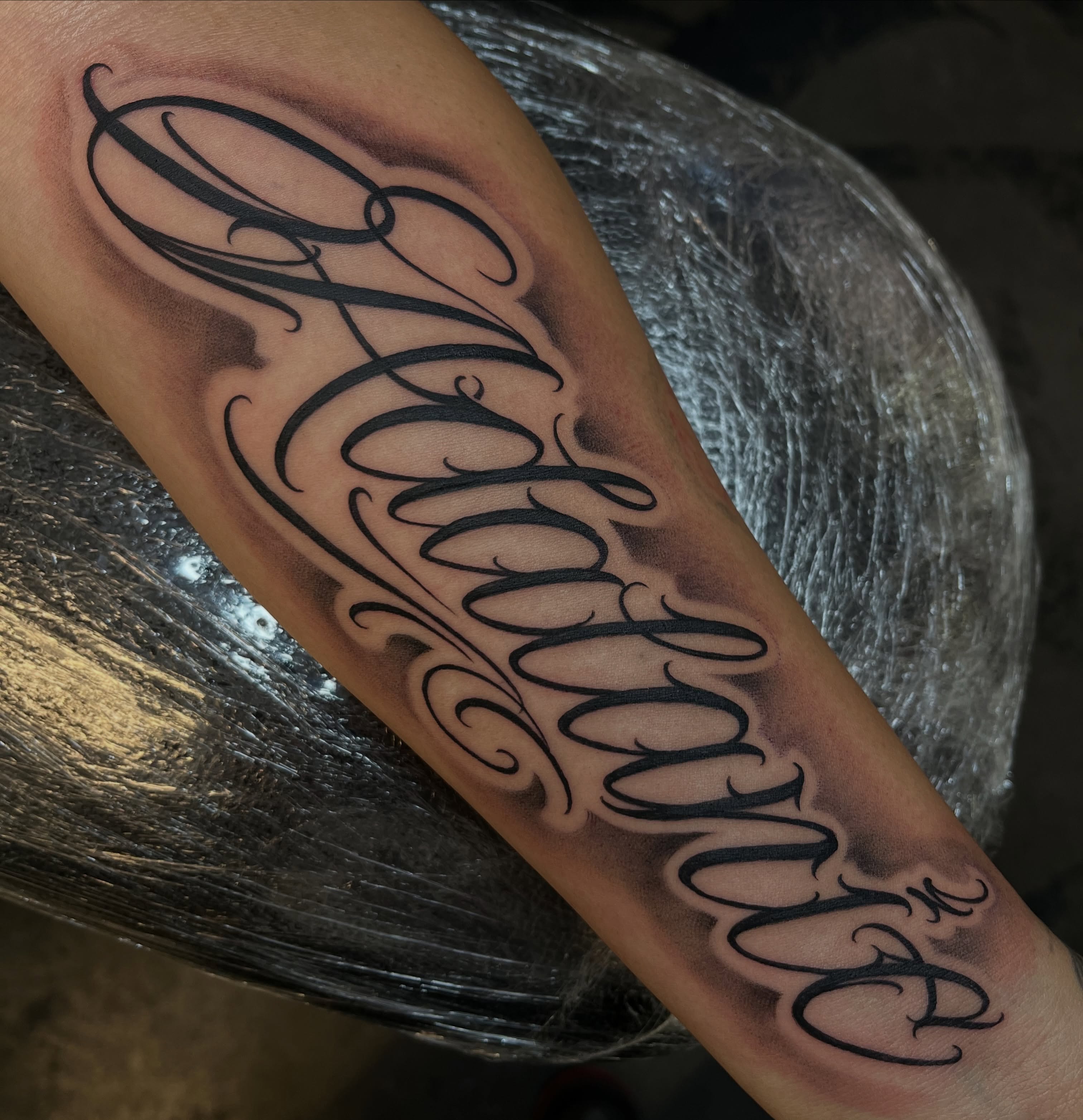 Script lettering lettering script tattoo on the forearm by Kwete Tatuajes