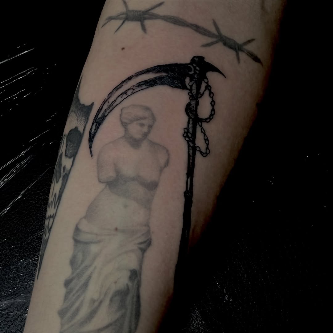 Grim reaper scythe and statue sketch tattoo on the forearm by Jordan Sandoval