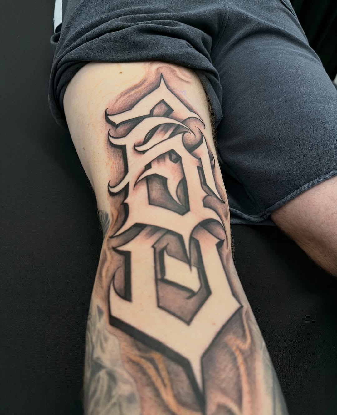 Tattoo by @tat2caps602 โ lettering_script, black_and_grey