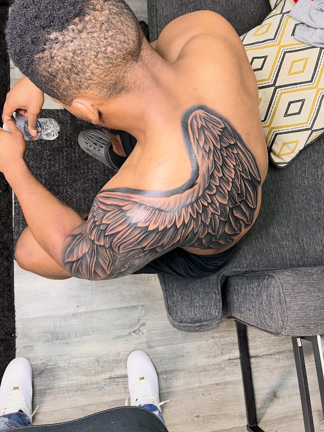 Angel wing realism tattoo on the shoulder by Deonte Dwayne Durham