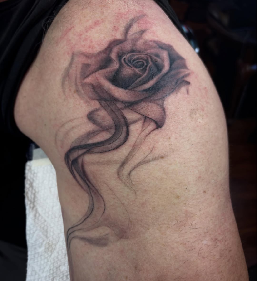 Rose with smoke dotwork tattoo on the shoulder by dayton skuse, Portland, Oregon