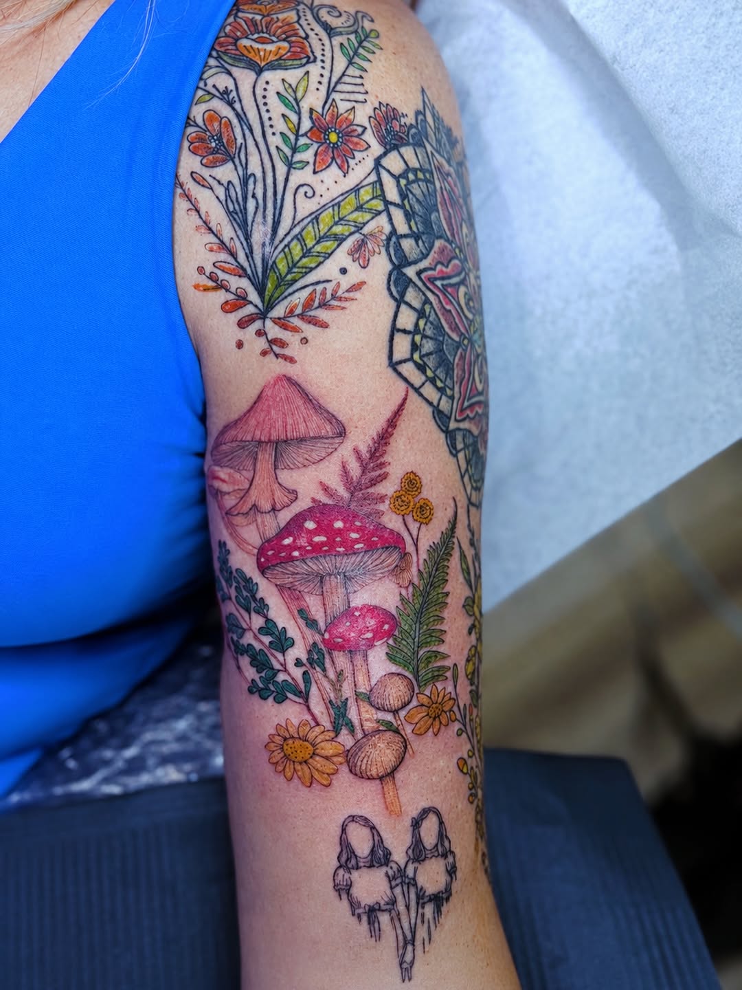 Mushrooms and flowers American traditional tattoo on the forearm by Ink About Me - Amanda’s Fine Lines