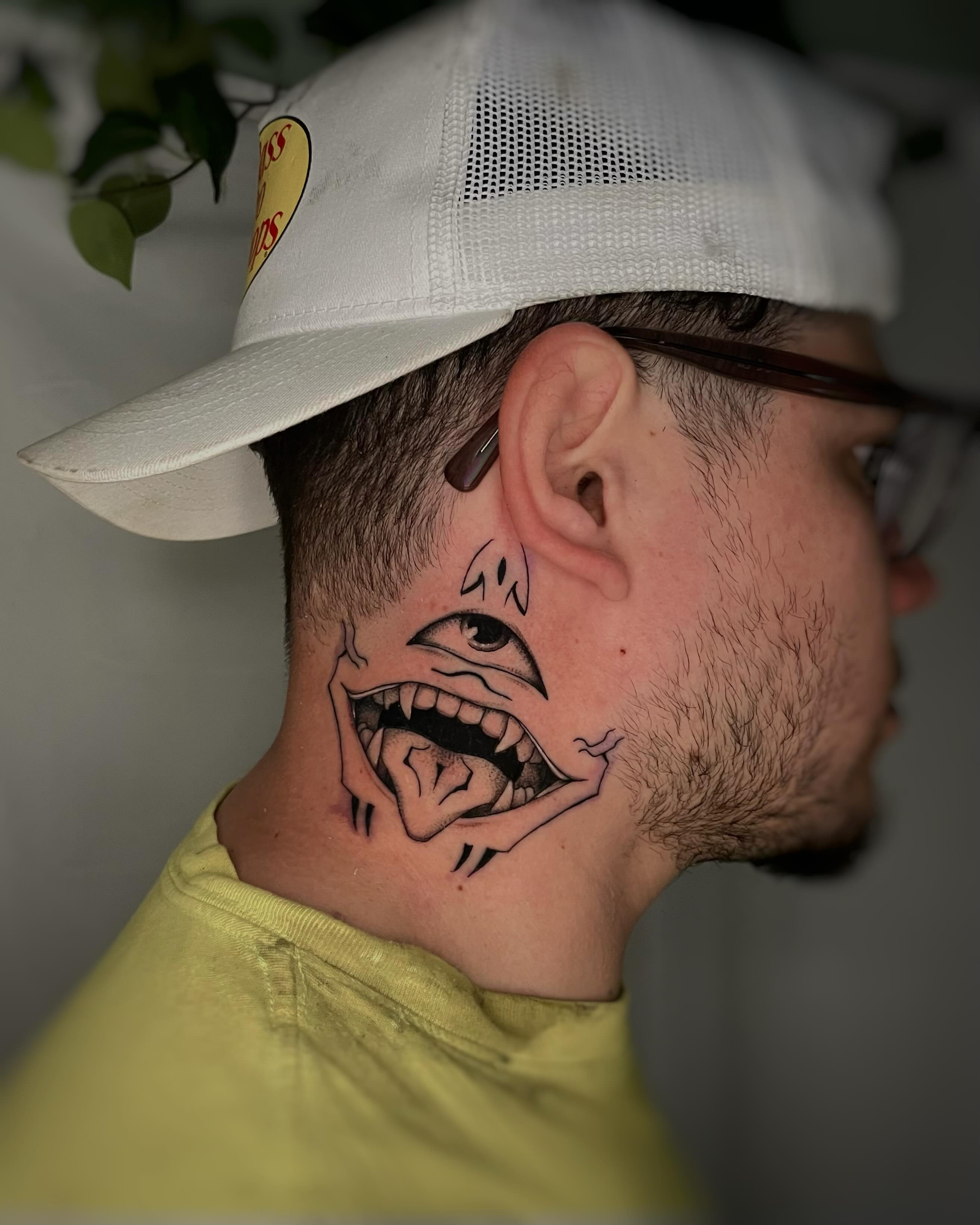Angry face black and grey tattoo on the neck by Sam chase, Naperville, Illinois