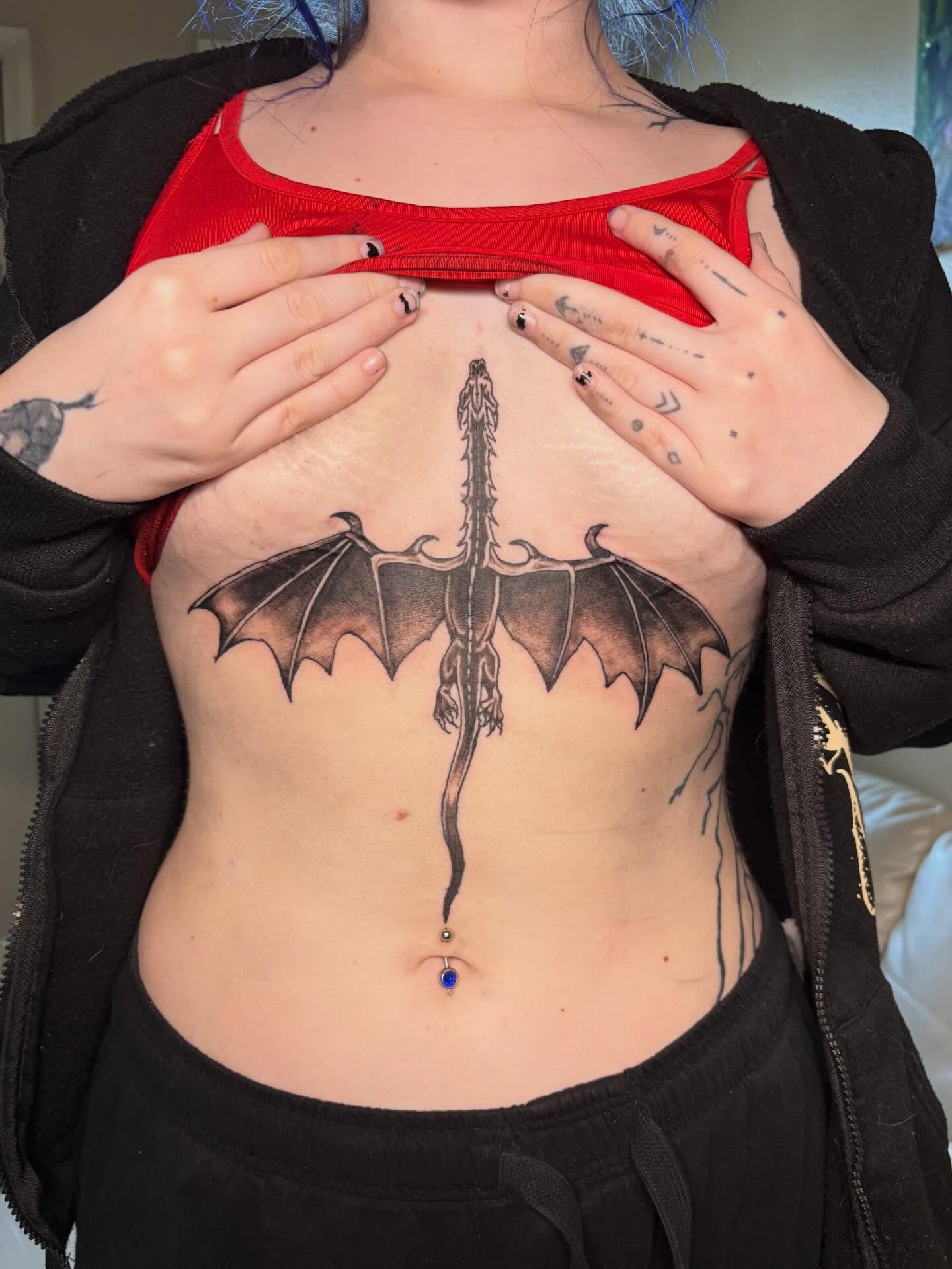 Dragon black and grey tattoo on the torso by K.L Tattoo Uptown
