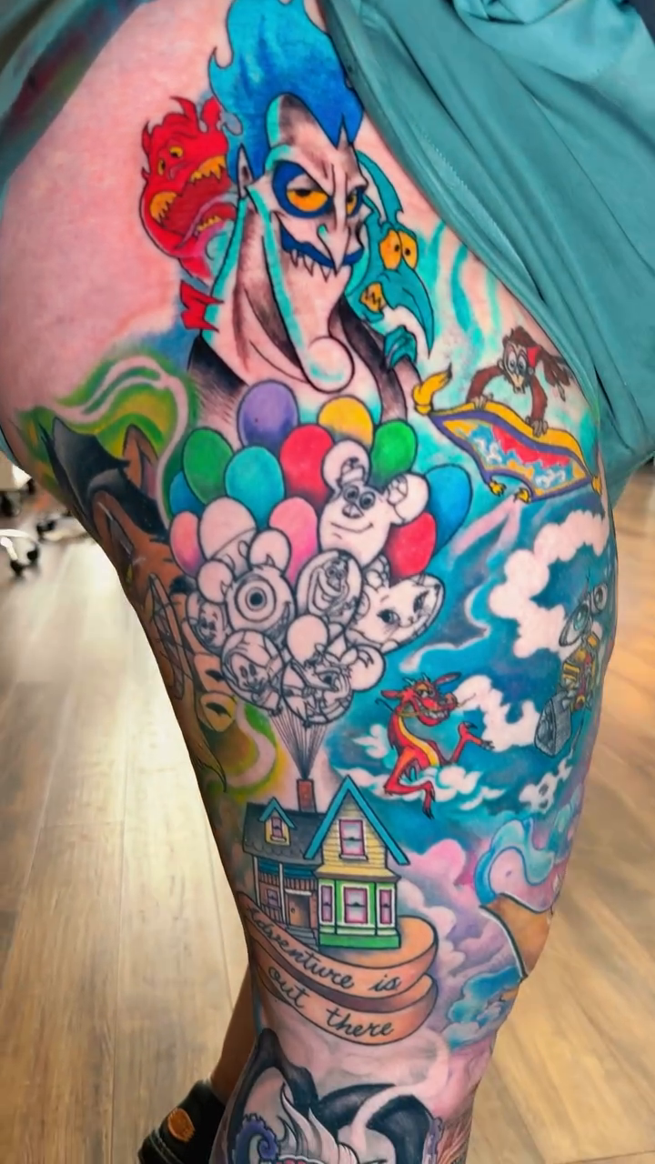 Disney characters leg sleeve watercolor tattoo on the leg by Chad Meado