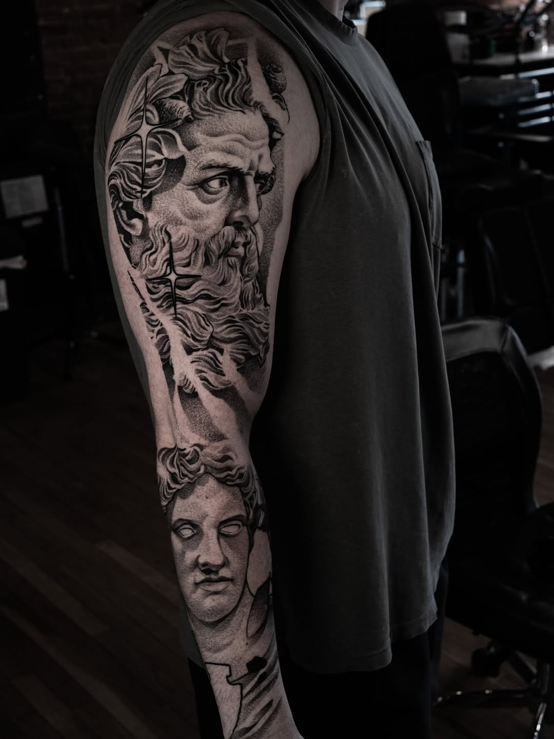 Classical busts surrealism tattoo on the forearm by Craig St Peter, Kansas City, Missouri