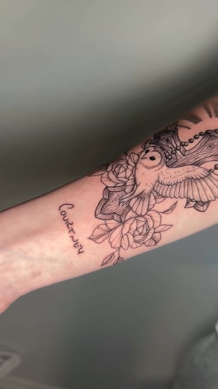 Dove with sun rays and roses fine line tattoo on the forearm by Mandy Kaur