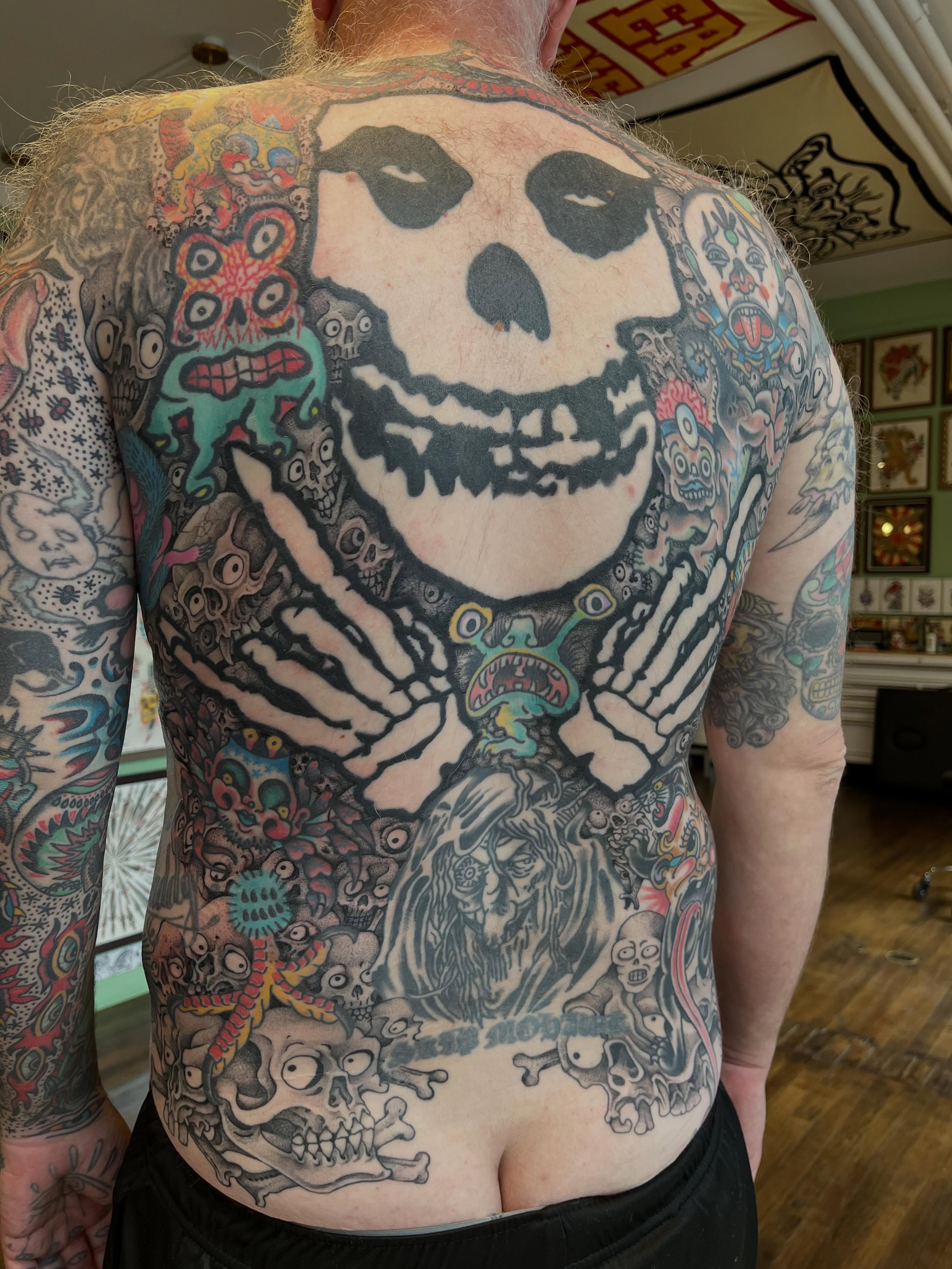 Skeleton American traditional tattoo on the back by Chris Kline