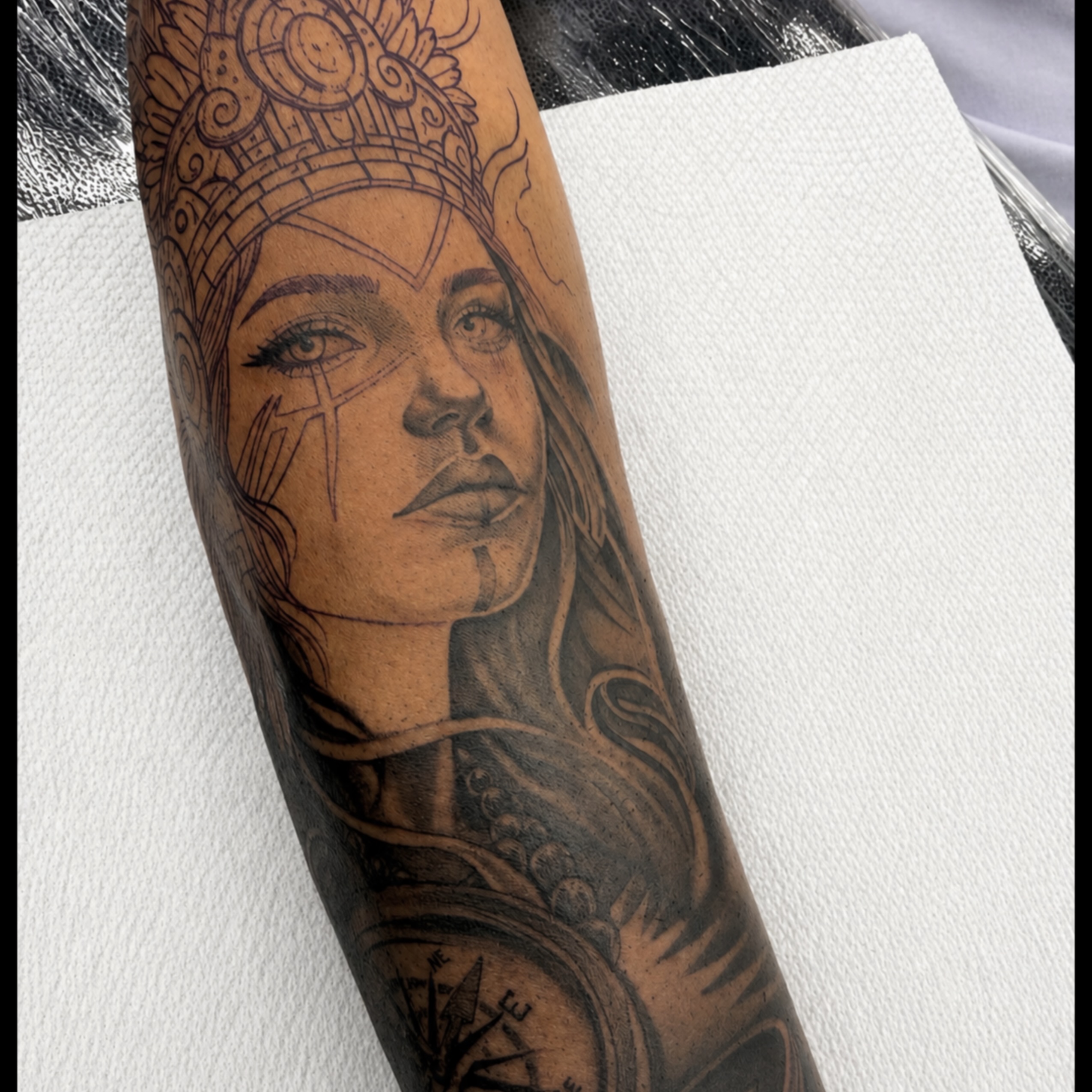 Woman with headdress realism tattoo on the forearm by Indiana Tattoo Artist