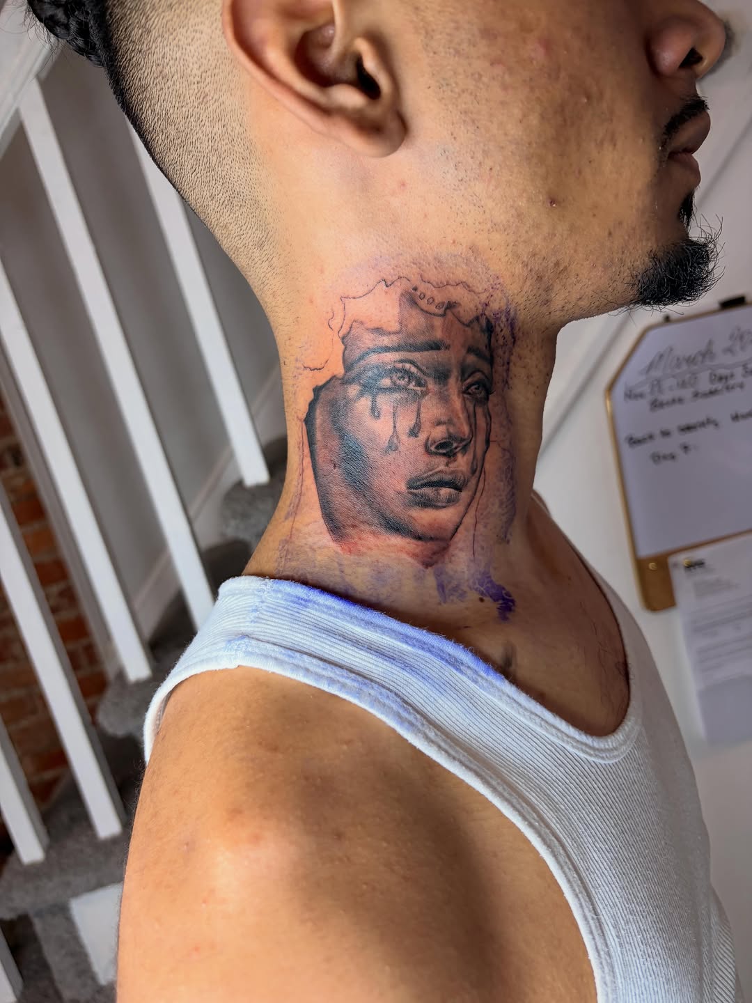 Crying face portrait tattoo on the neck by Inked By E, Philadelphia, Pennsylvania