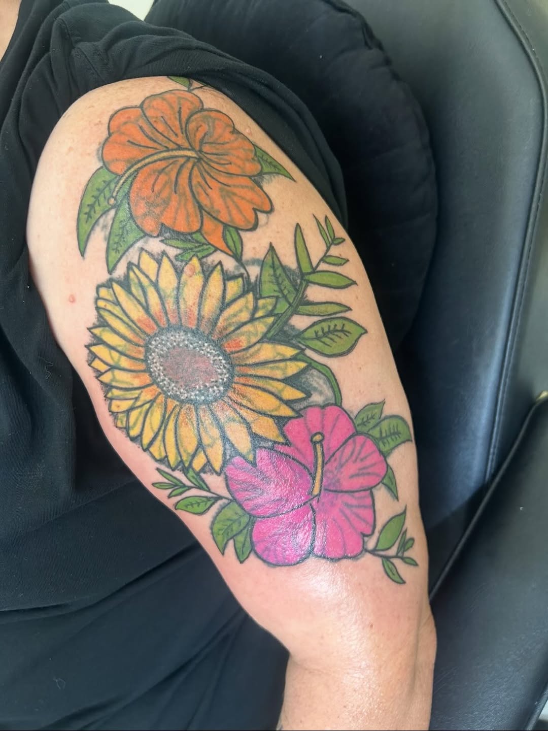 Sunflower and hibiscus flowers neo-traditional tattoo on the shoulder by Sarah Sharee💃🏽