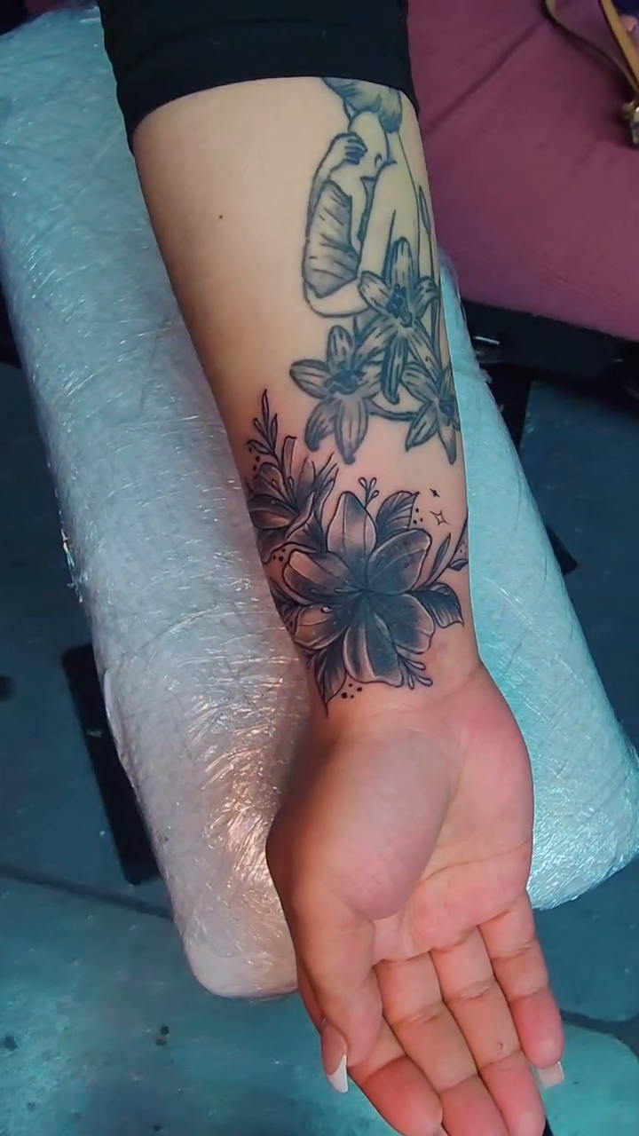Floral arrangement fine line tattoo on the forearm by Kai_Tattoo