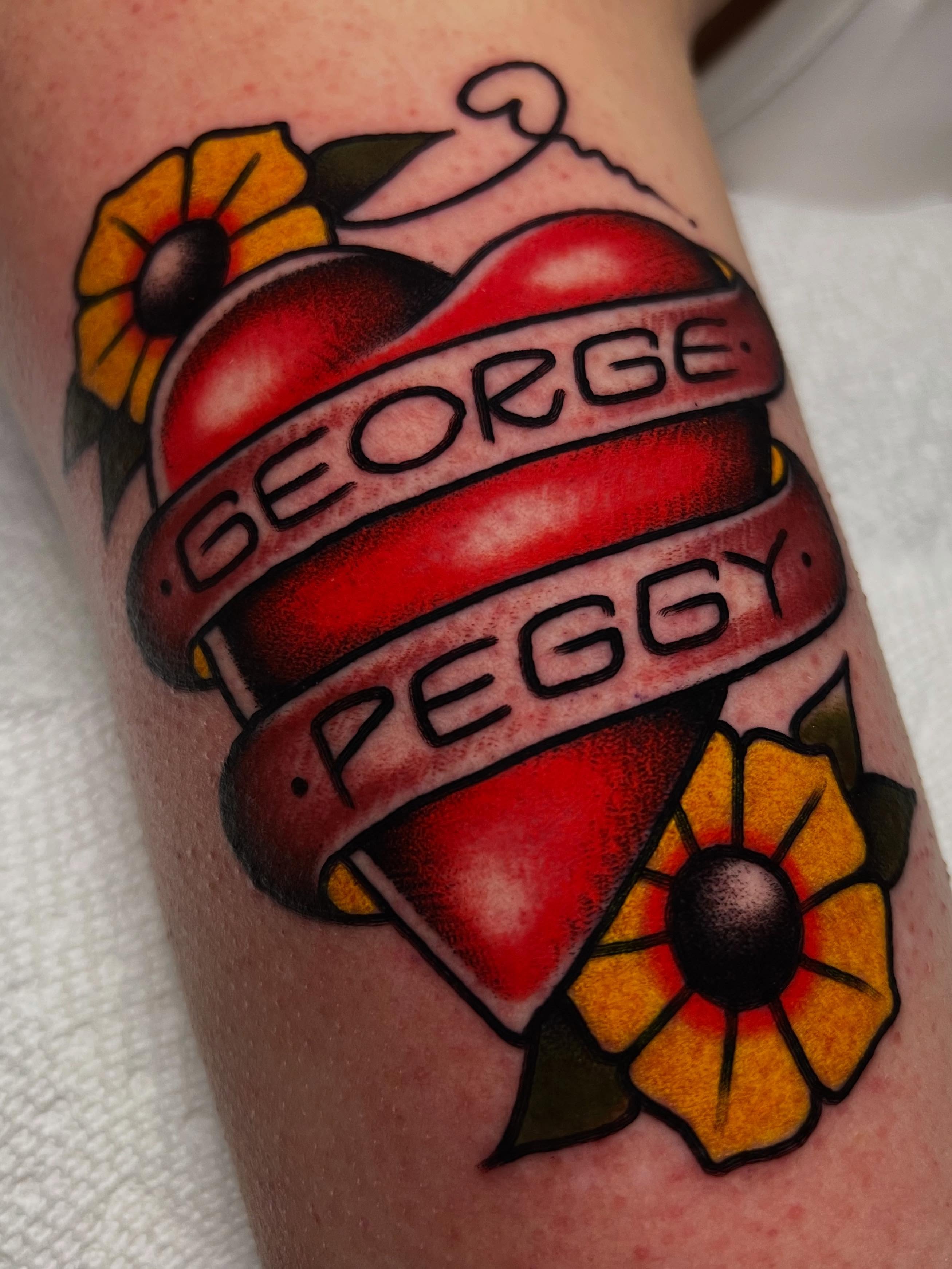 Heart with names American traditional tattoo on the forearm by ᴍᴀᴛᴛ ᴀʟᴇxᴀɴᴅᴇʀ