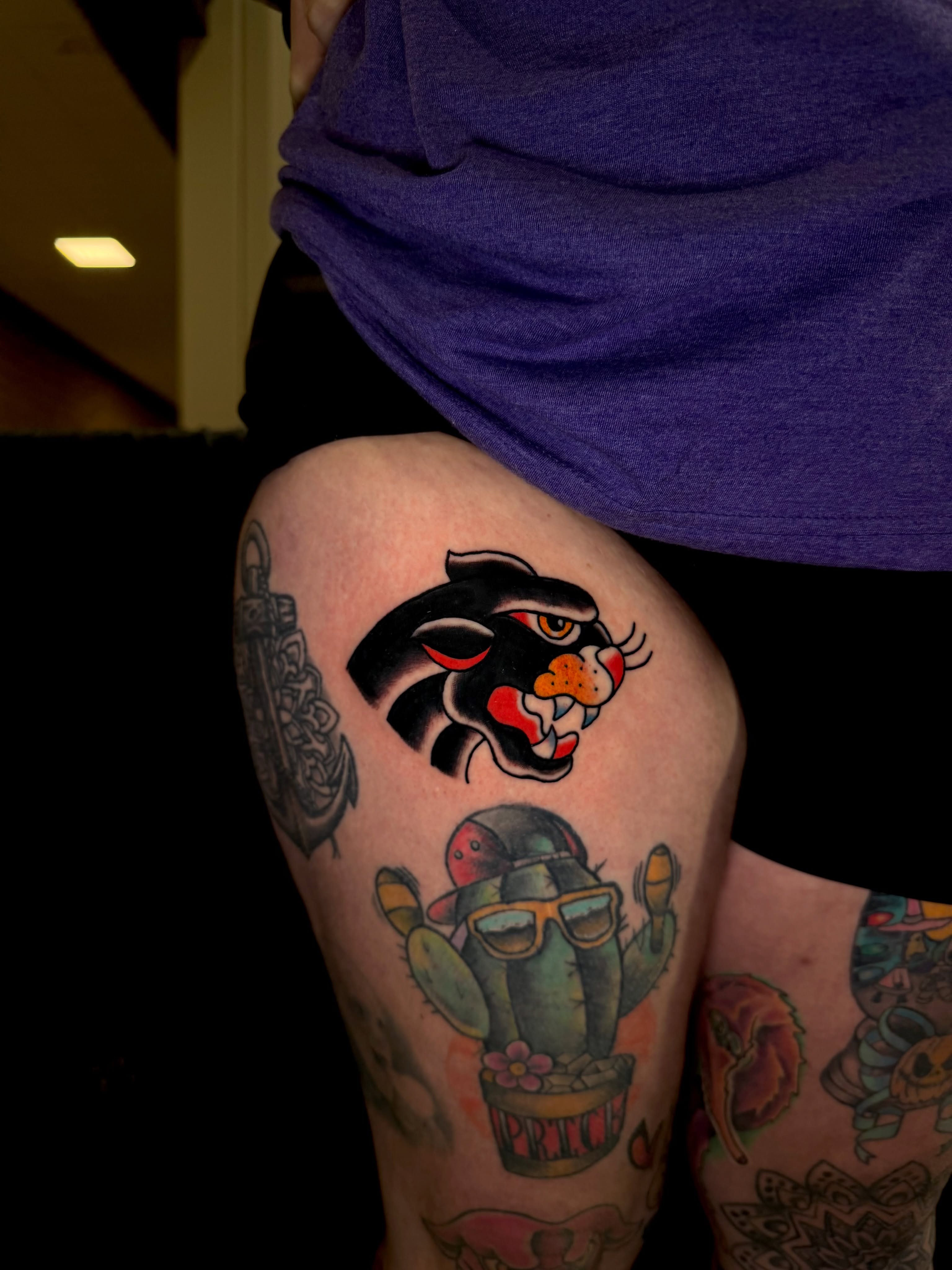 Panther and cactus American traditional tattoo on the thigh by Dustie Pitstick