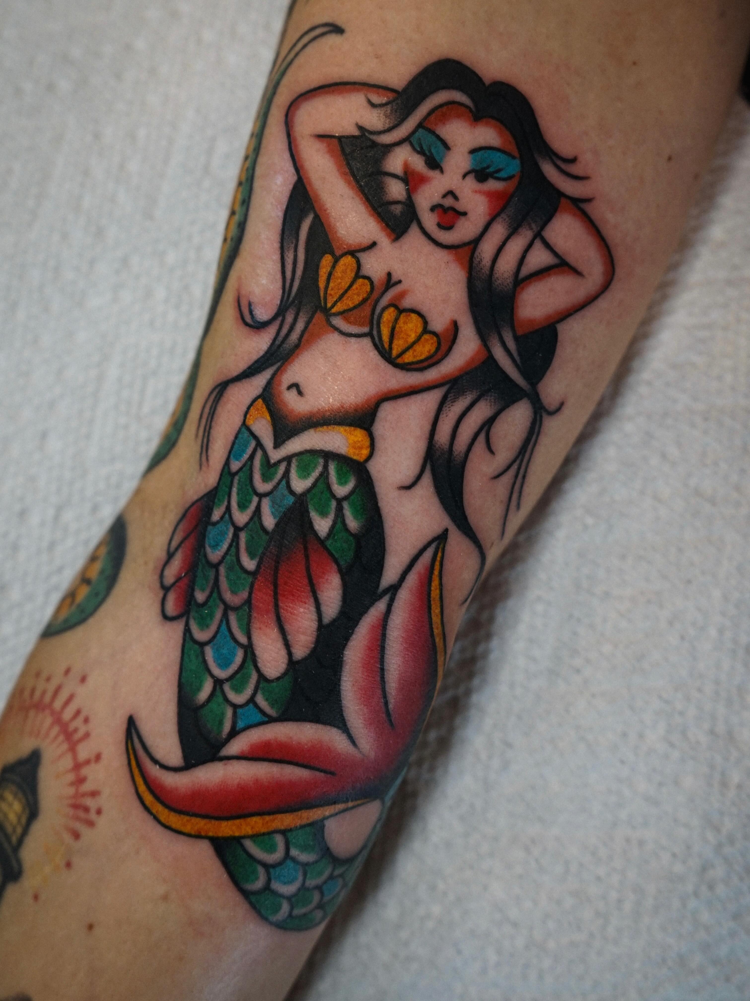 Mermaid American traditional tattoo on the forearm by Emily Devenz