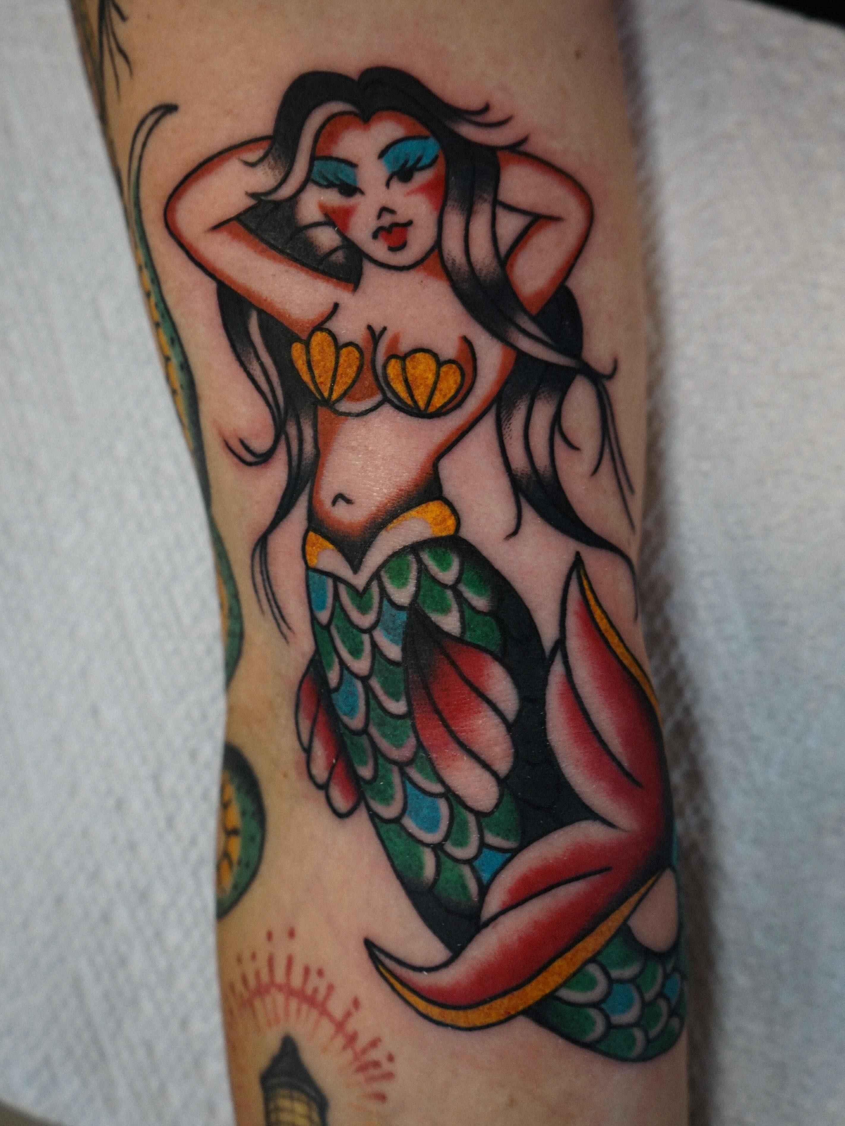 Mermaid American traditional tattoo on the forearm by Emily Devenz