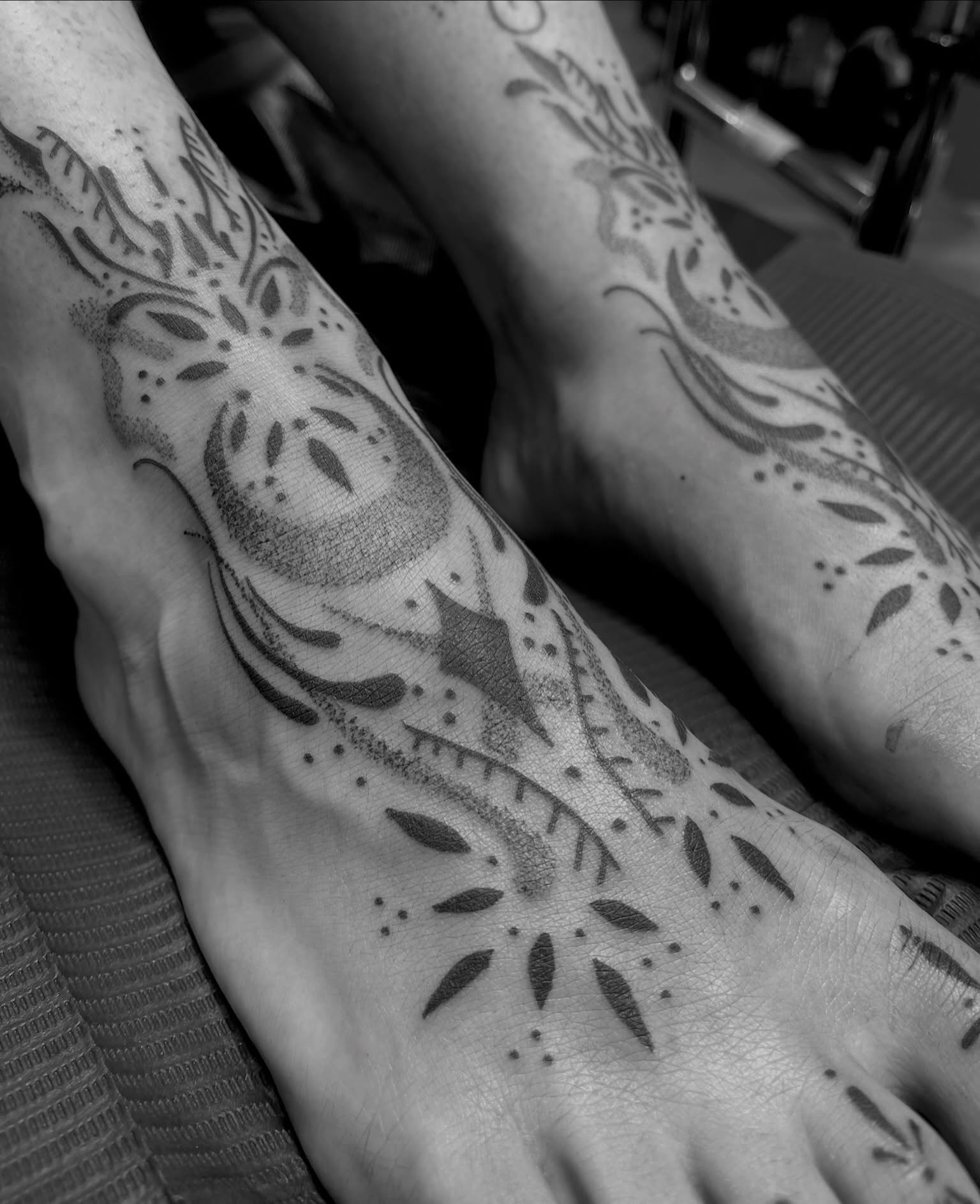 Abstract nature dotwork tattoo on the foot by Destiny Tolman