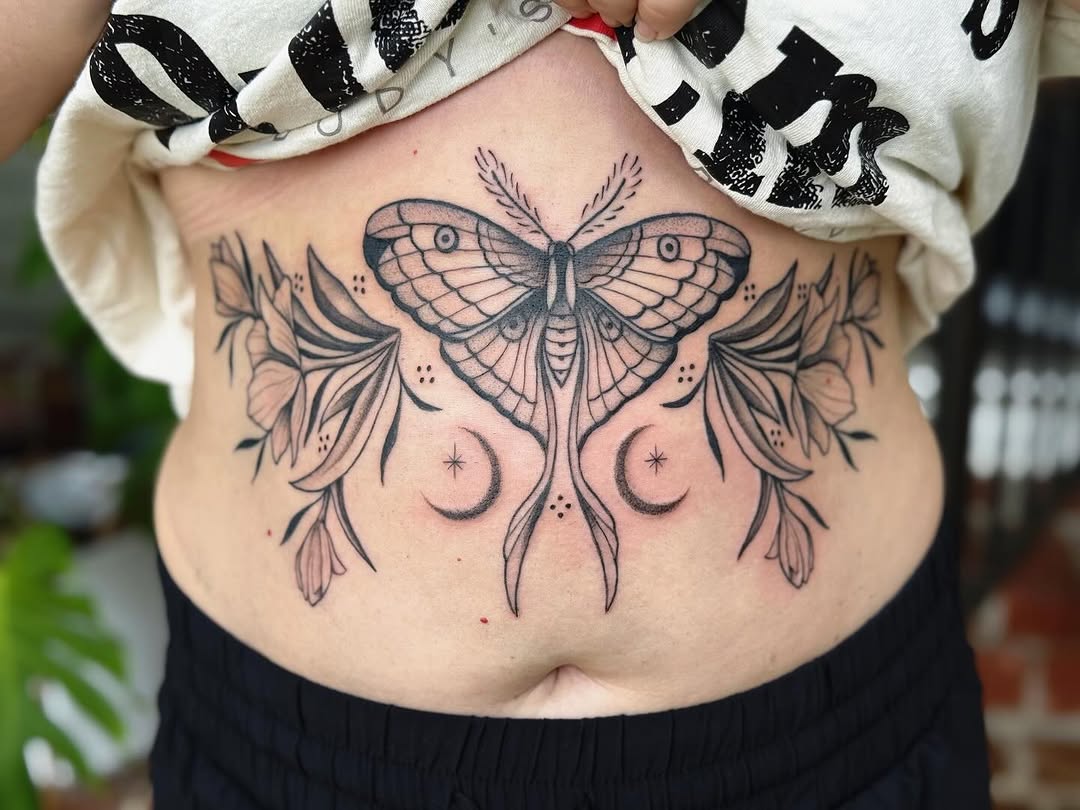 Moth and flowers fine line tattoo on the torso by π½πππππ π½πππππππ, New Orleans, Louisiana