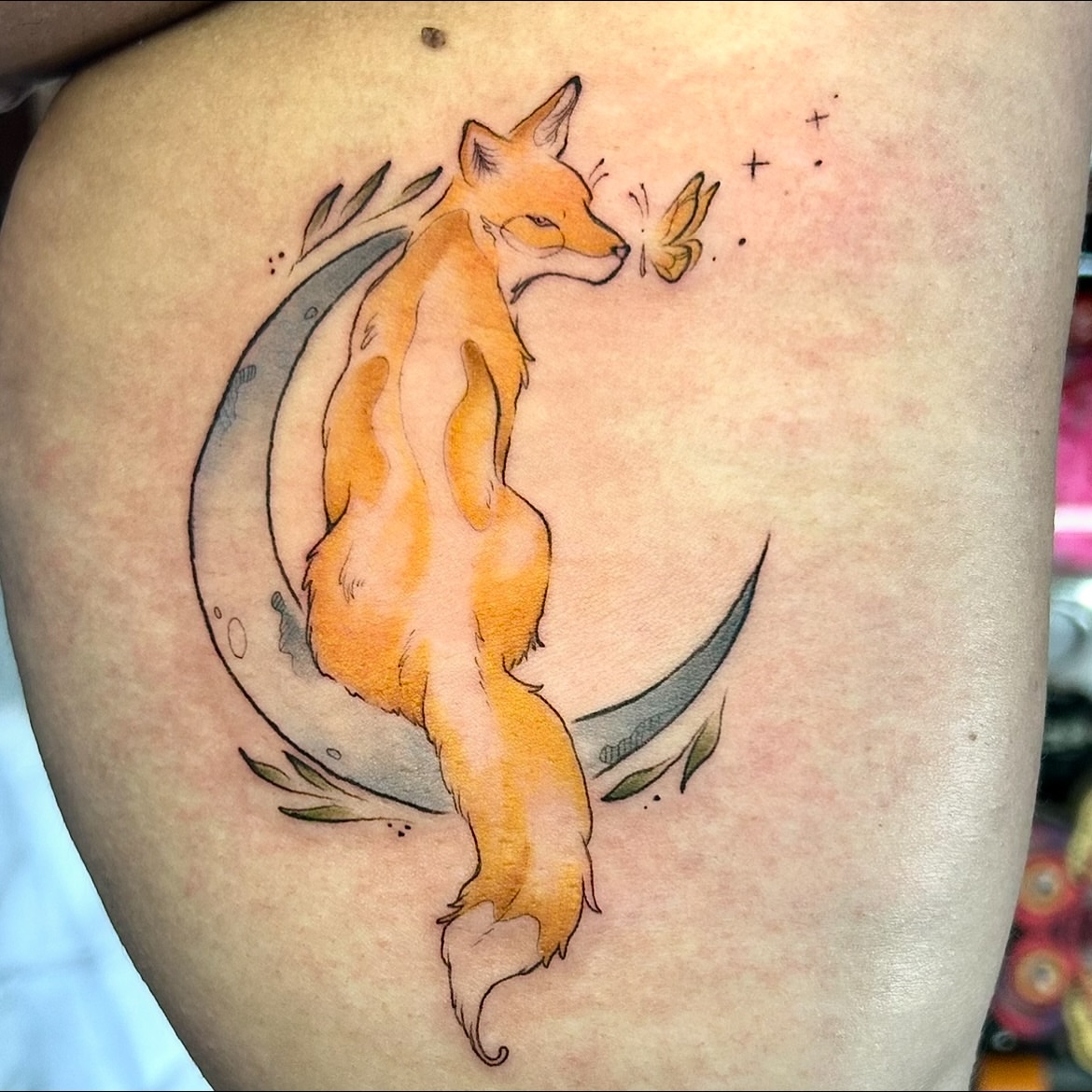 Fox and butterfly watercolor tattoo on the thigh by Maara Martinez