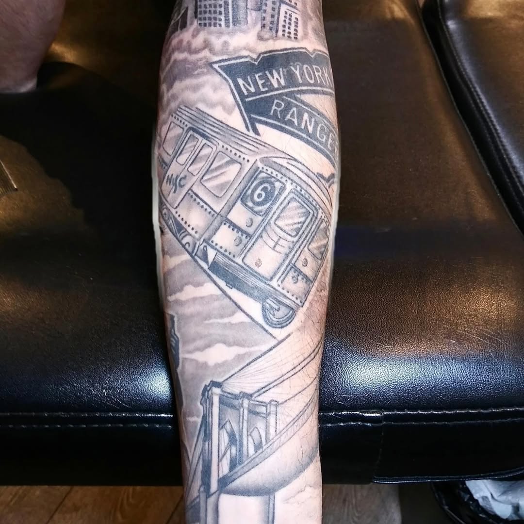New York City subway and bridge sketch tattoo on the forearm by Tommy Houlihan