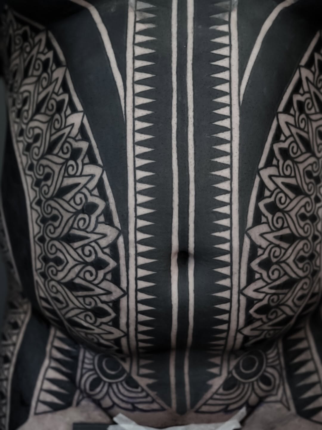 Tribal patterns on torso tribal tattoo on the chest by Oliver kenton, San Diego, California