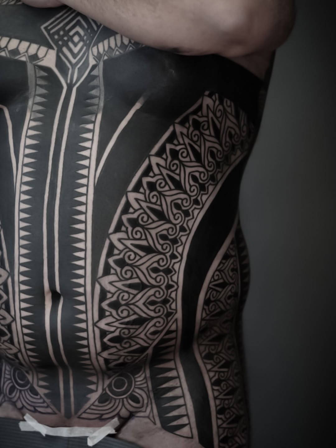 Tribal ornamental patterns tribal tattoo on the torso by Oliver kenton, San Diego, California