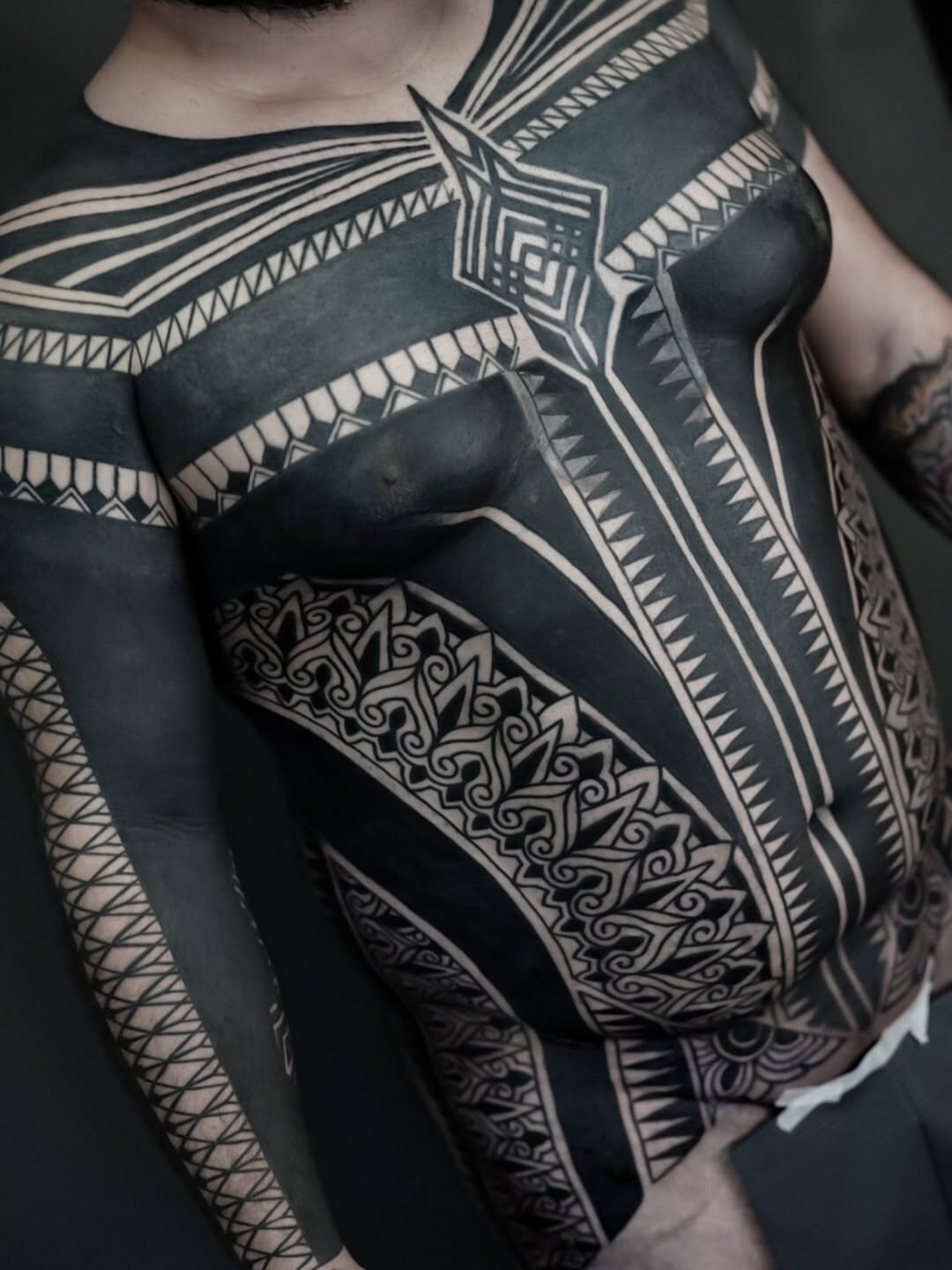 Geometric tribal patterns tribal tattoo on the chest by Oliver kenton, San Diego, California