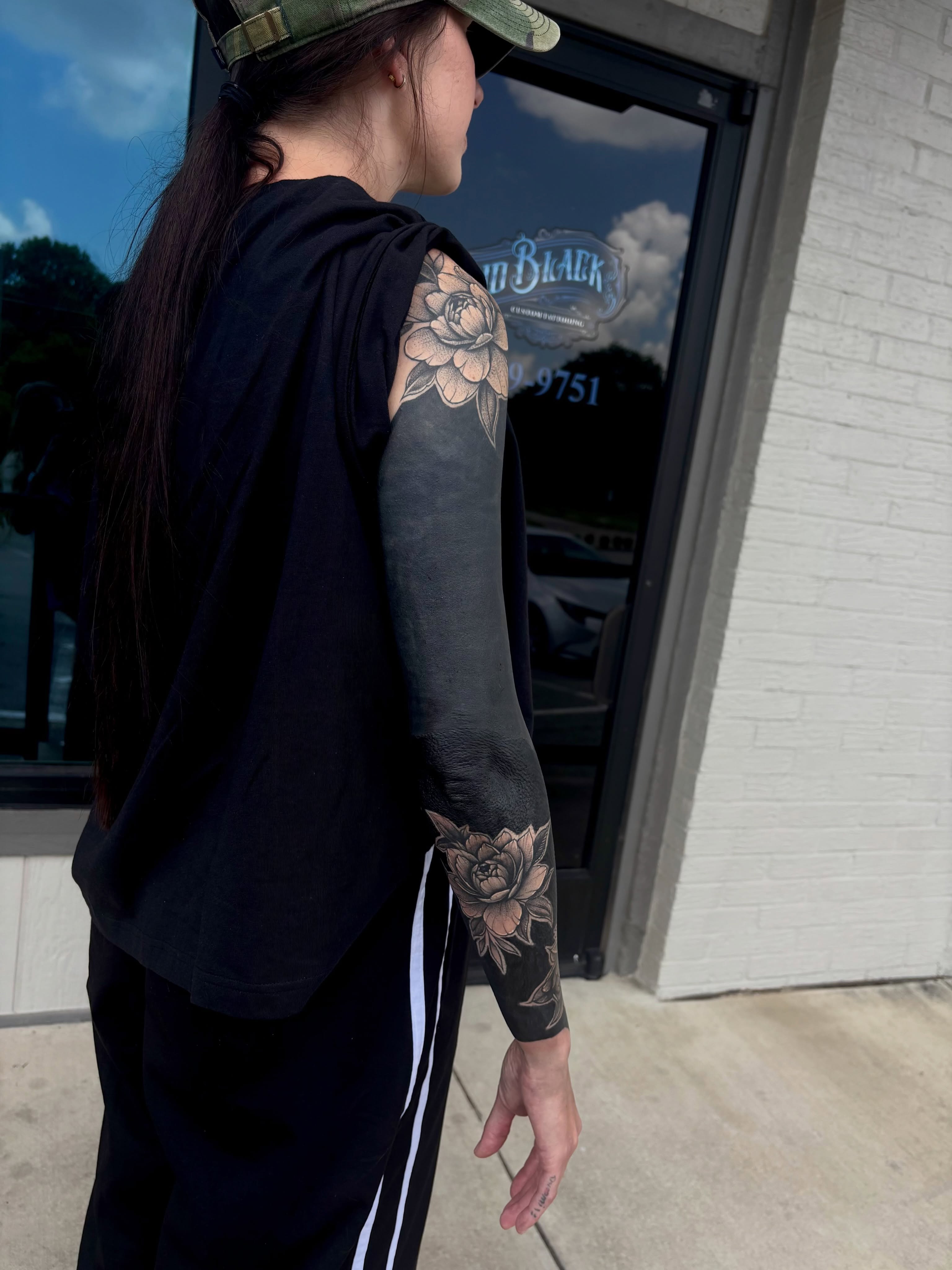 Floral black and grey tattoo on the upper arm by 🔥Zoë Zahasky Tattoos🔥