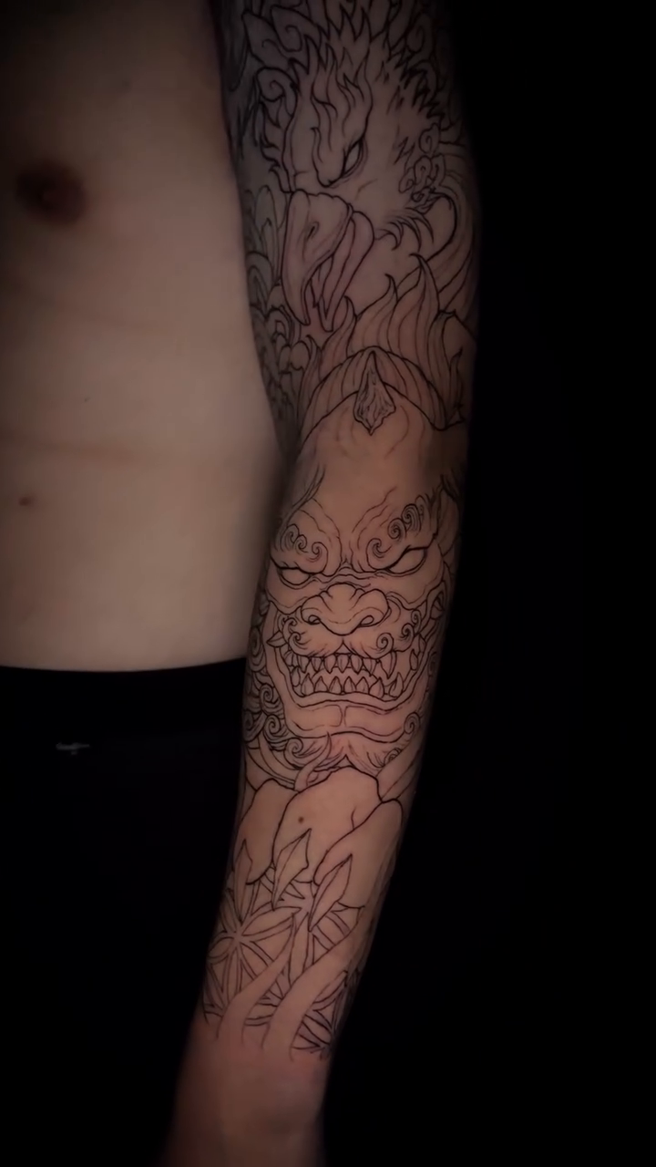 Dragon and chrysanthemum sleeve Japanese tattoo on the upper arm by bev