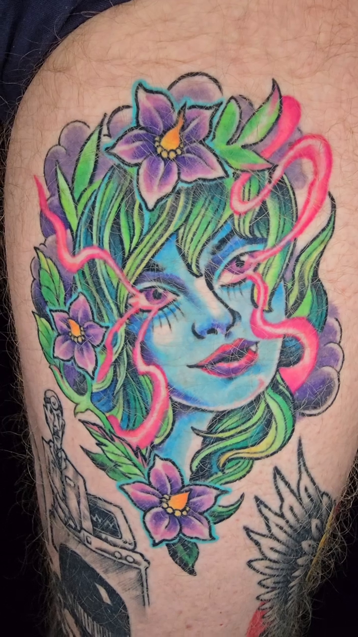 Woman with flowers neo-traditional tattoo by Joseph Jeffers