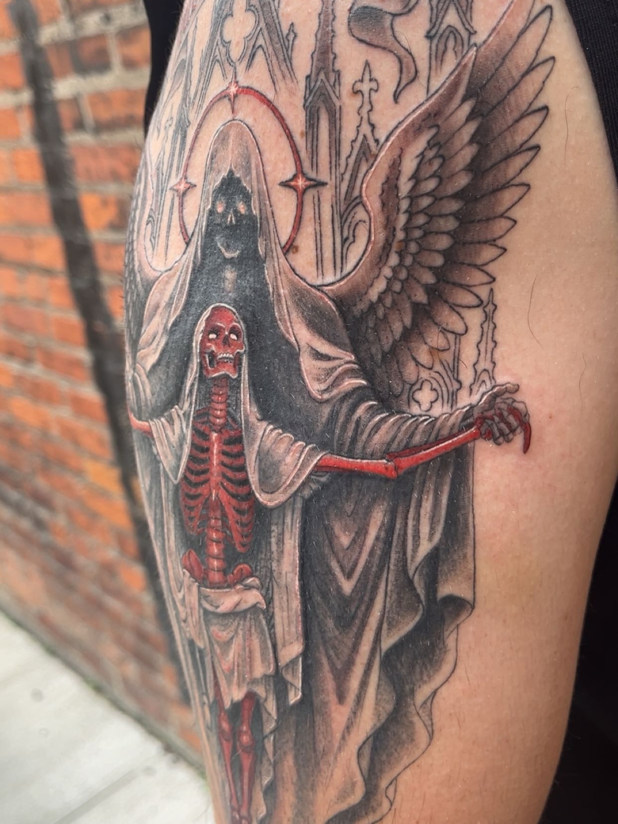 Death and skeleton dark realism tattoo on the forearm by Elle Miller