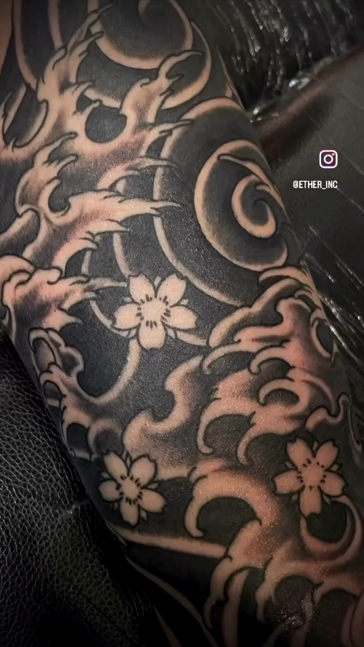 Koi fish and waves Japanese tattoo on the forearm by Erik Pagtakhan
