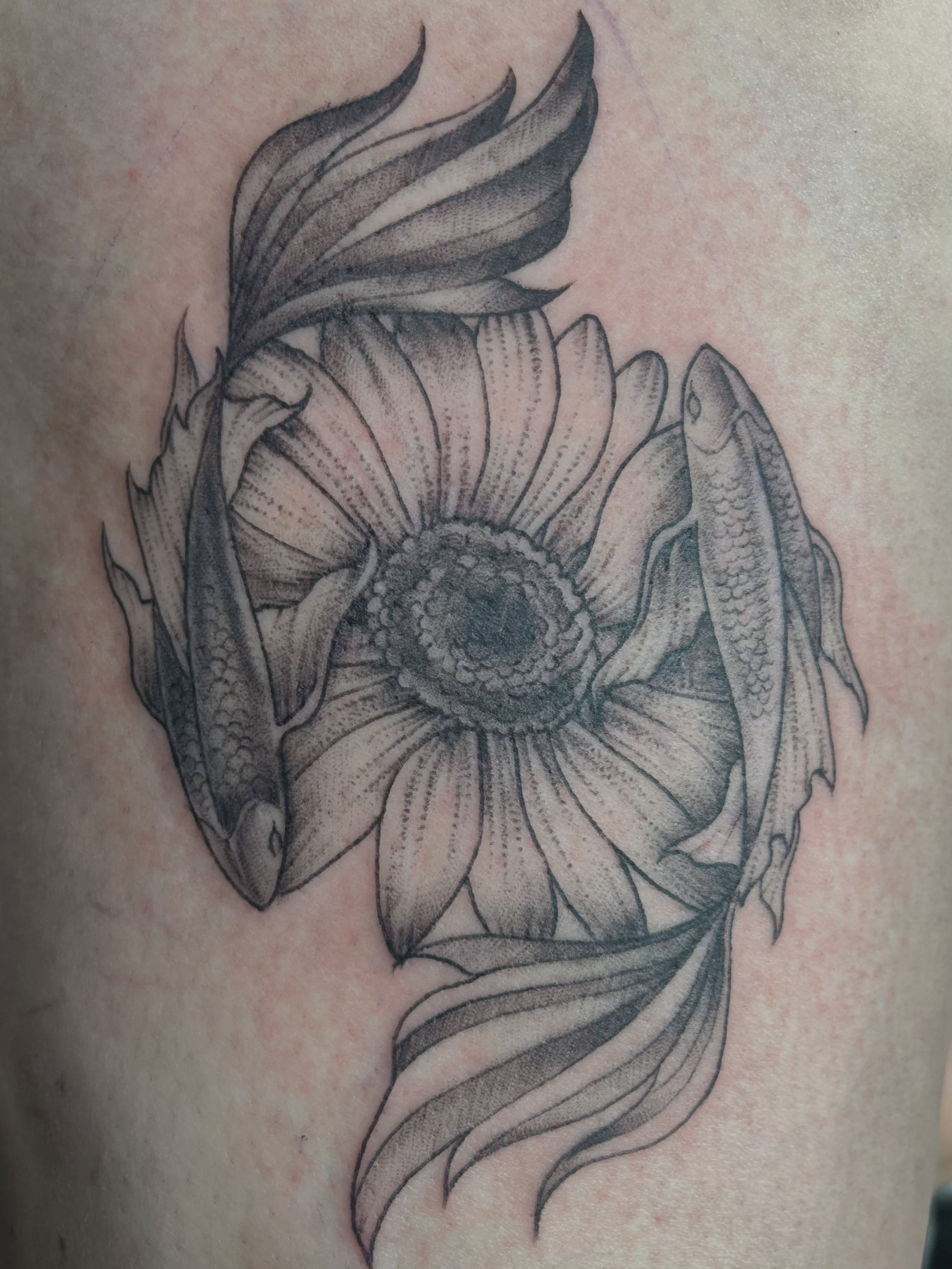 Flower with fish dotwork tattoo on the thigh by Tattoos and art by Ghost Shipe