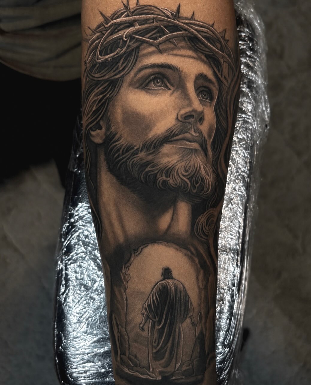 Jesus Christ portrait realism tattoo on the forearm by Jayden A