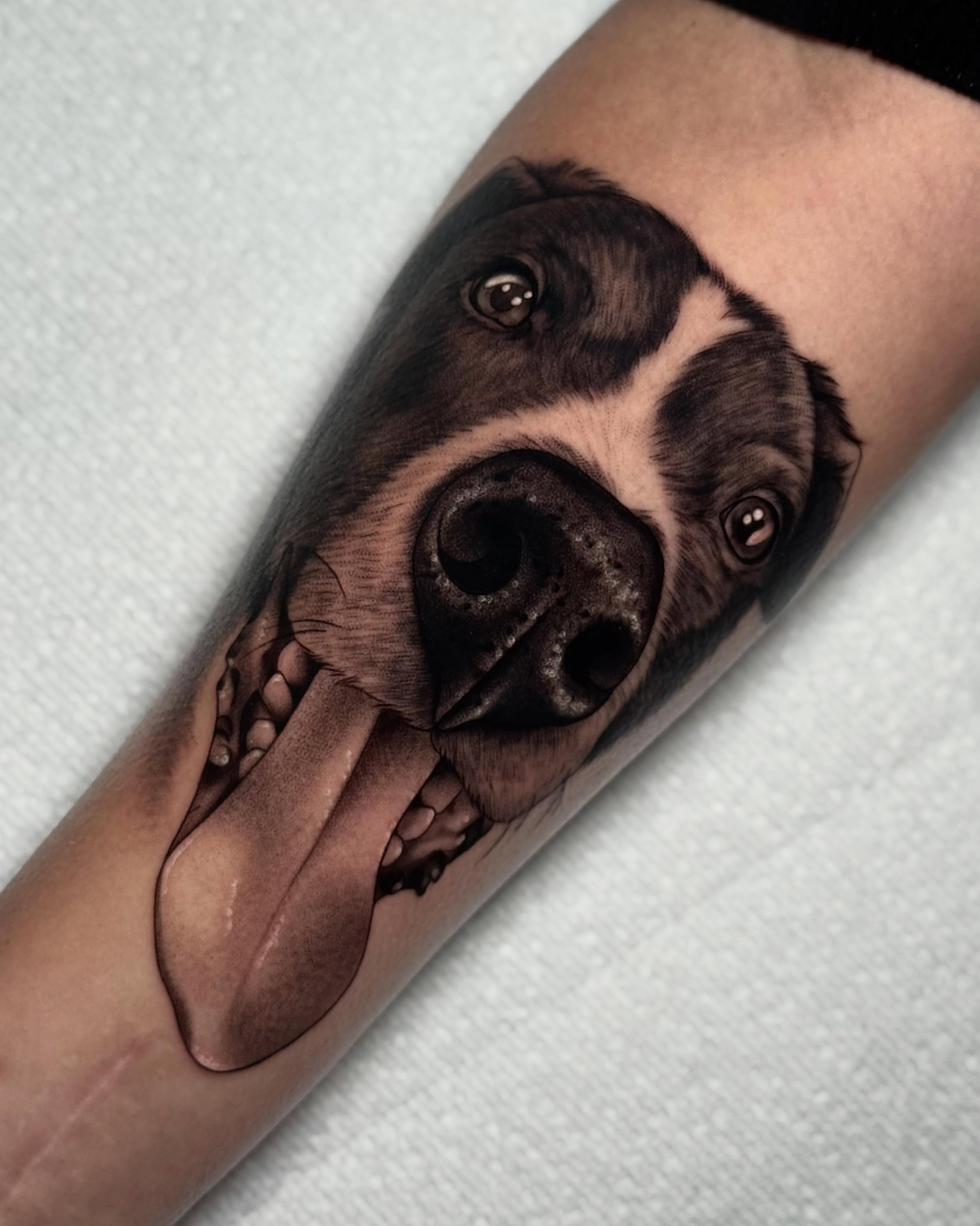 Dog portrait realism tattoo on the forearm by Bell Bolton