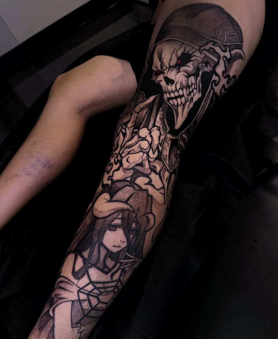 Anime character and skull geometric tattoo on the forearm by Melissa "Lotuss" Chan