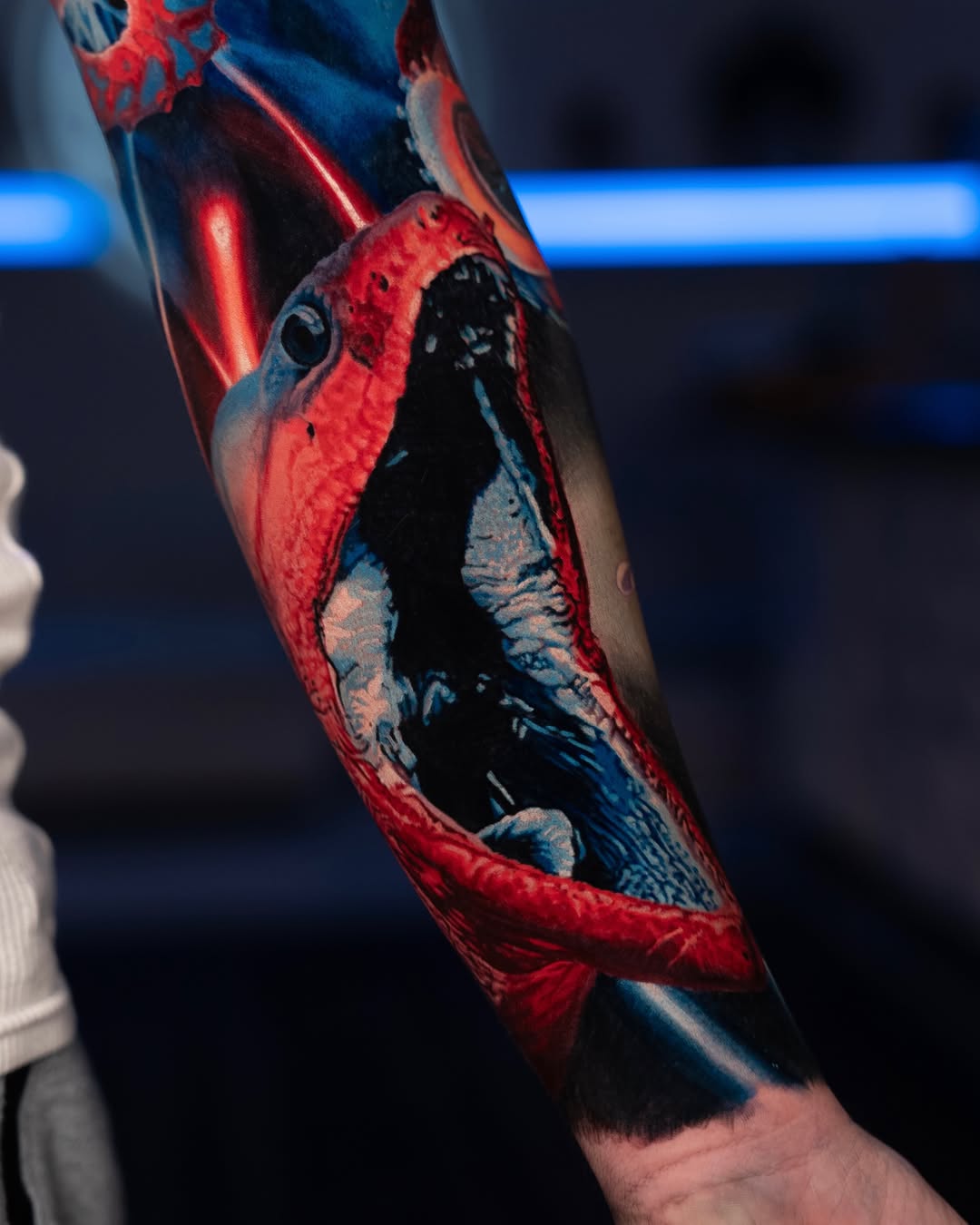 Monster mouth with glowing lights biomech tattoo on the upper arm by B R A D C H A R L e S