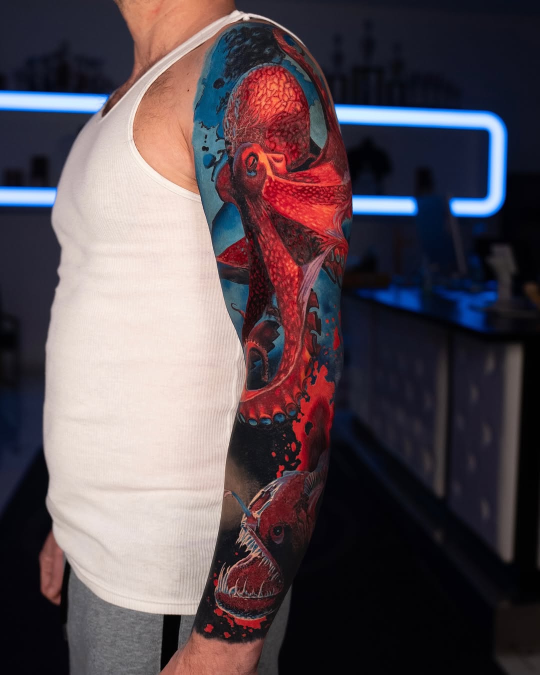 Octopus and anglerfish biomech tattoo on the upper arm by B R A D C H A R L e S