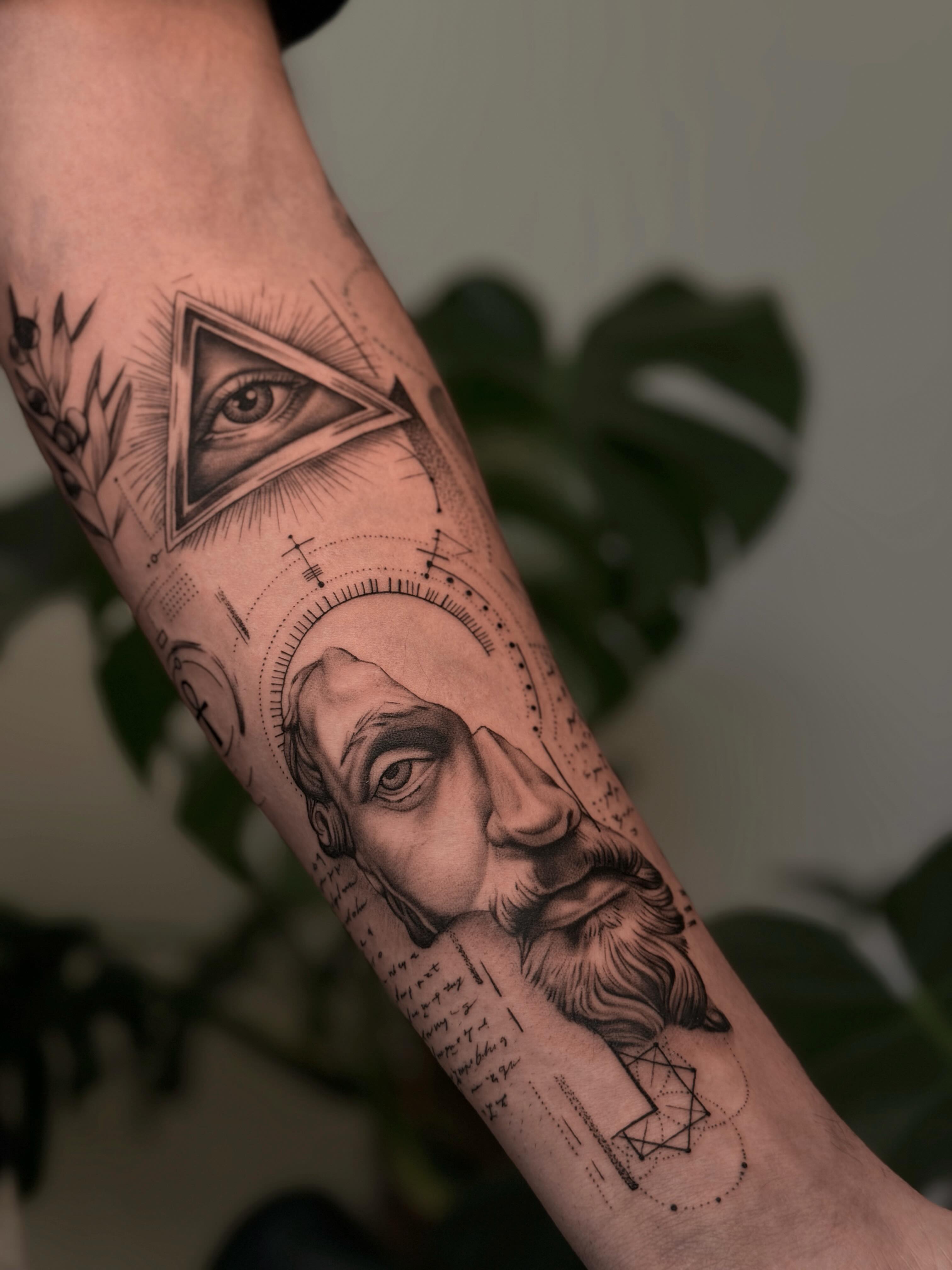 Geometric portrait geometric tattoo on the forearm by Christian Guerrero
