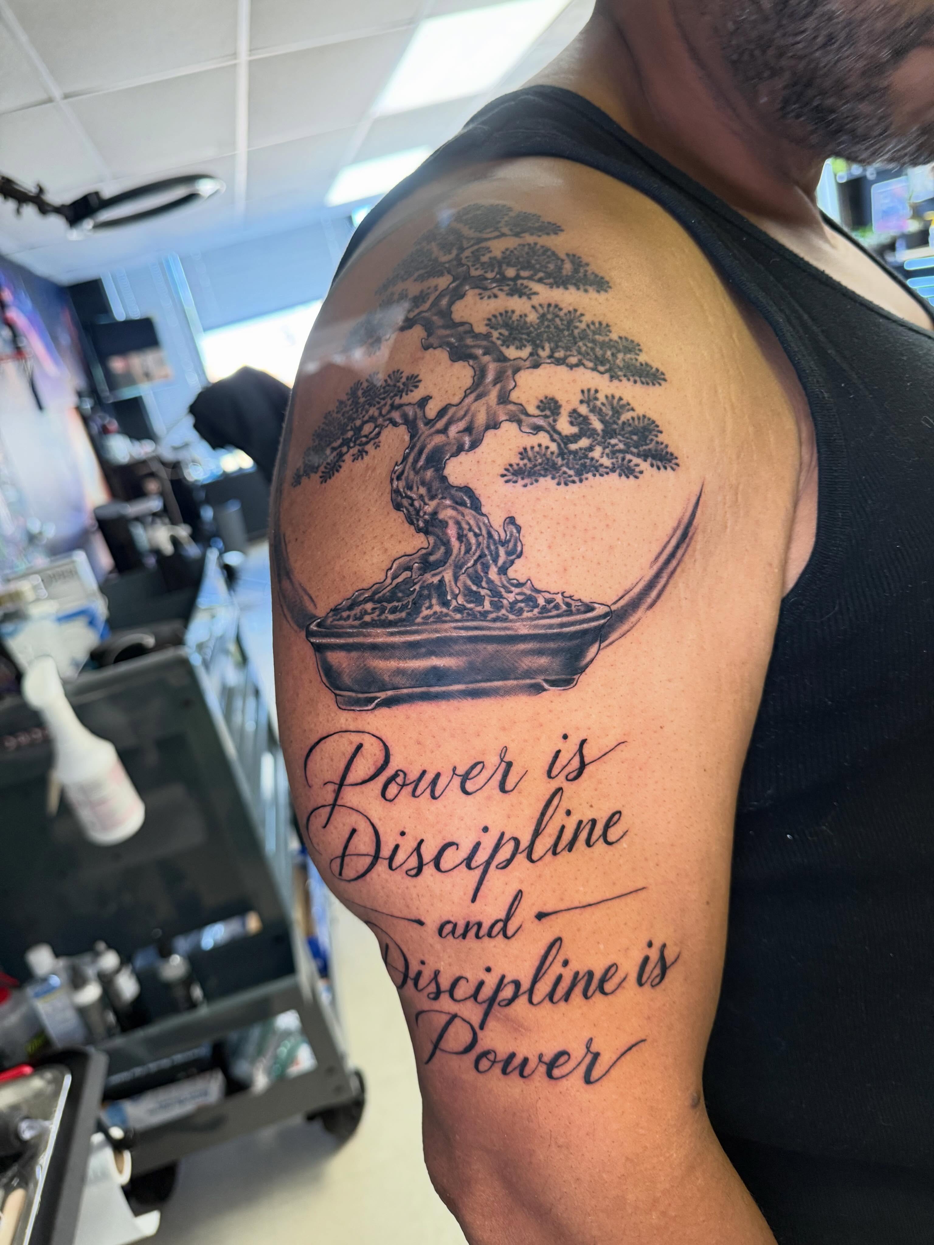 Bonsai tree black and grey tattoo on the shoulder by Steve - Tattoo Artist