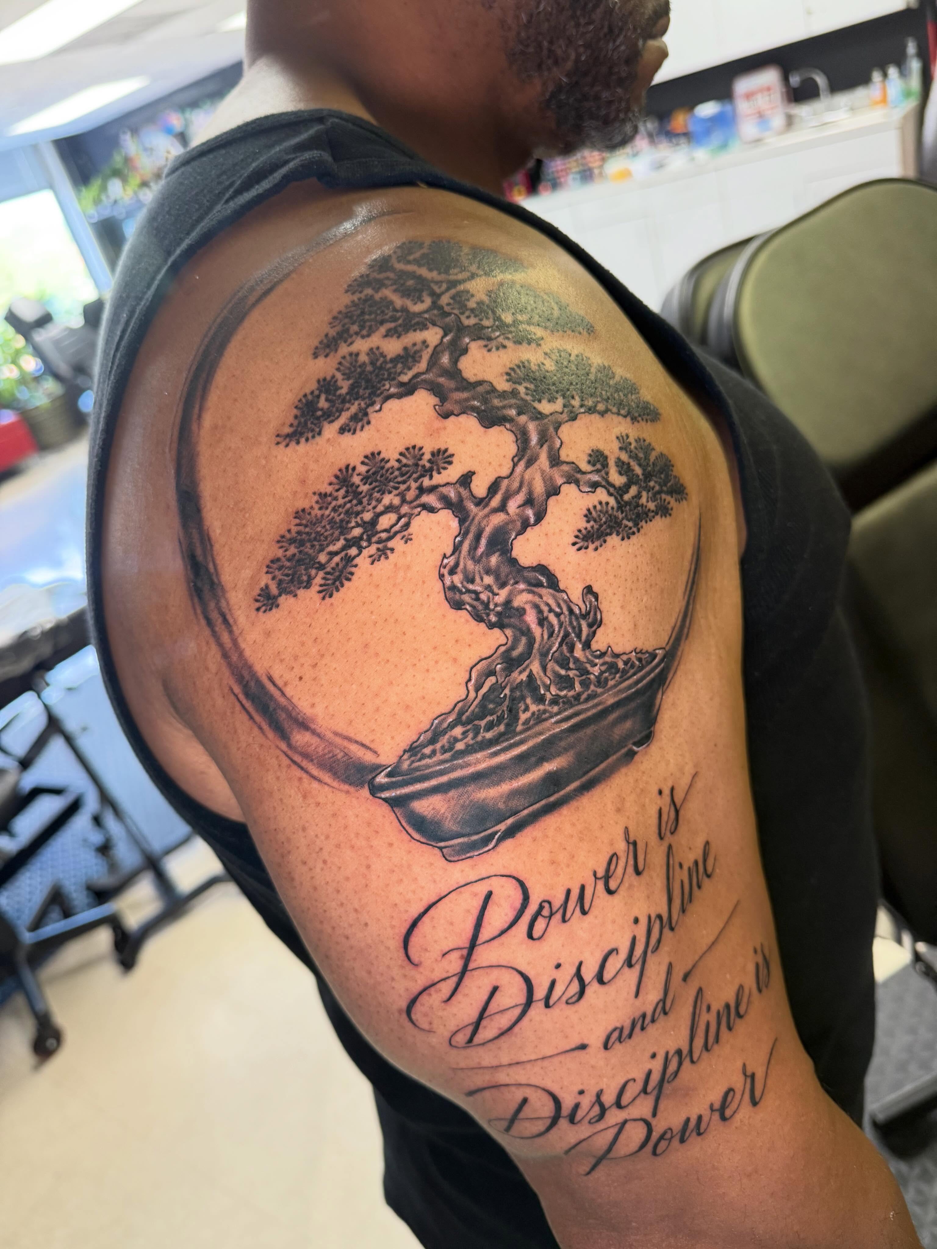 Bonsai tree black and grey tattoo on the shoulder by Steve - Tattoo Artist