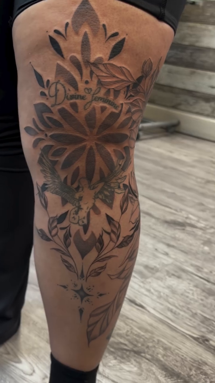 Mandala with floral elements and birds ornamental tattoo on the leg by Raciel Fabian Romero