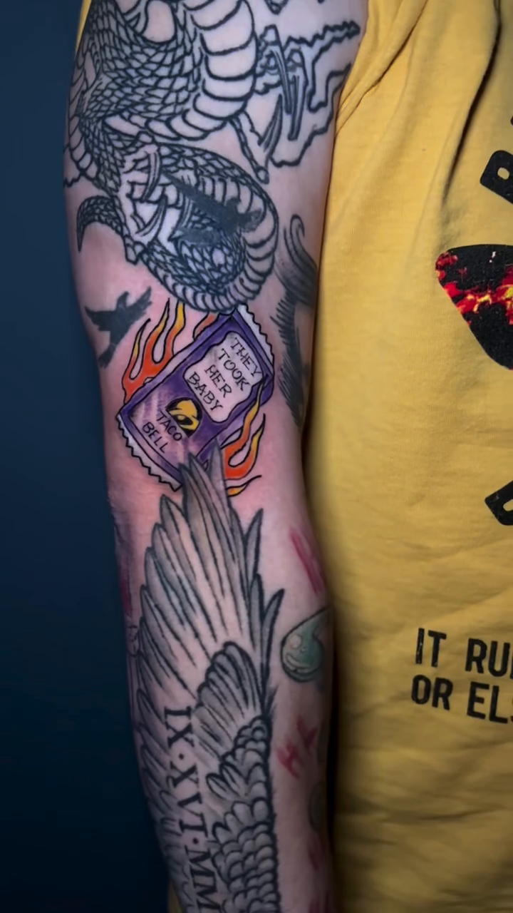 Taco Bell wrapper with flames American traditional tattoo on the forearm by 𝕯𝖆𝖒𝖎𝖆𝖓 𝕬𝖗𝖗𝖎𝖊𝖙𝖆