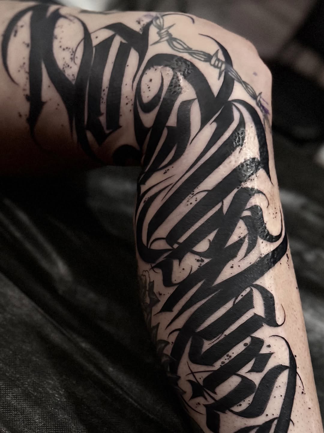 Tattoo by @wiseroner — lettering_script, blackwork