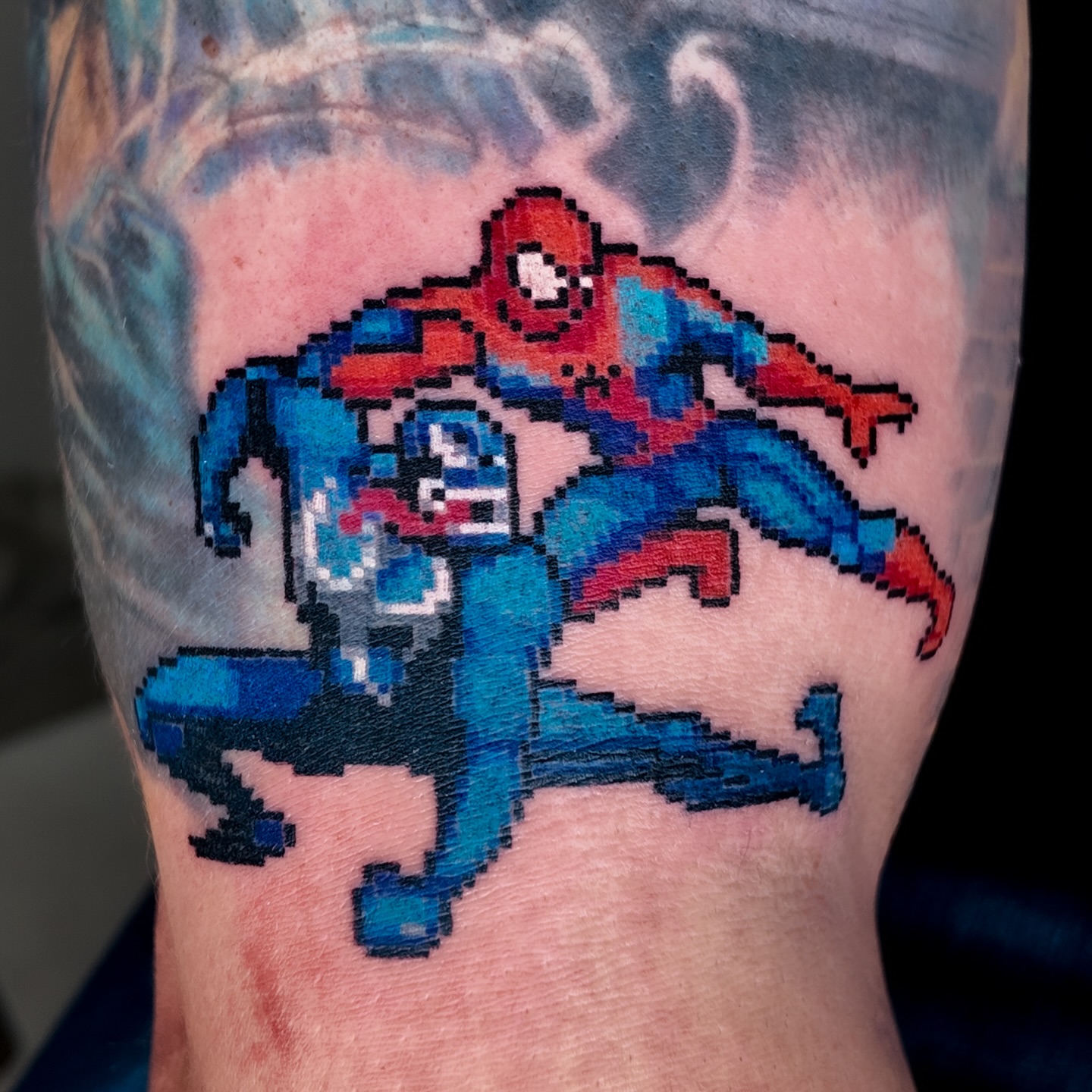 Spiderman and blue figure dotwork tattoo on the forearm by m r p i x e l ๐ธ๐ฌ