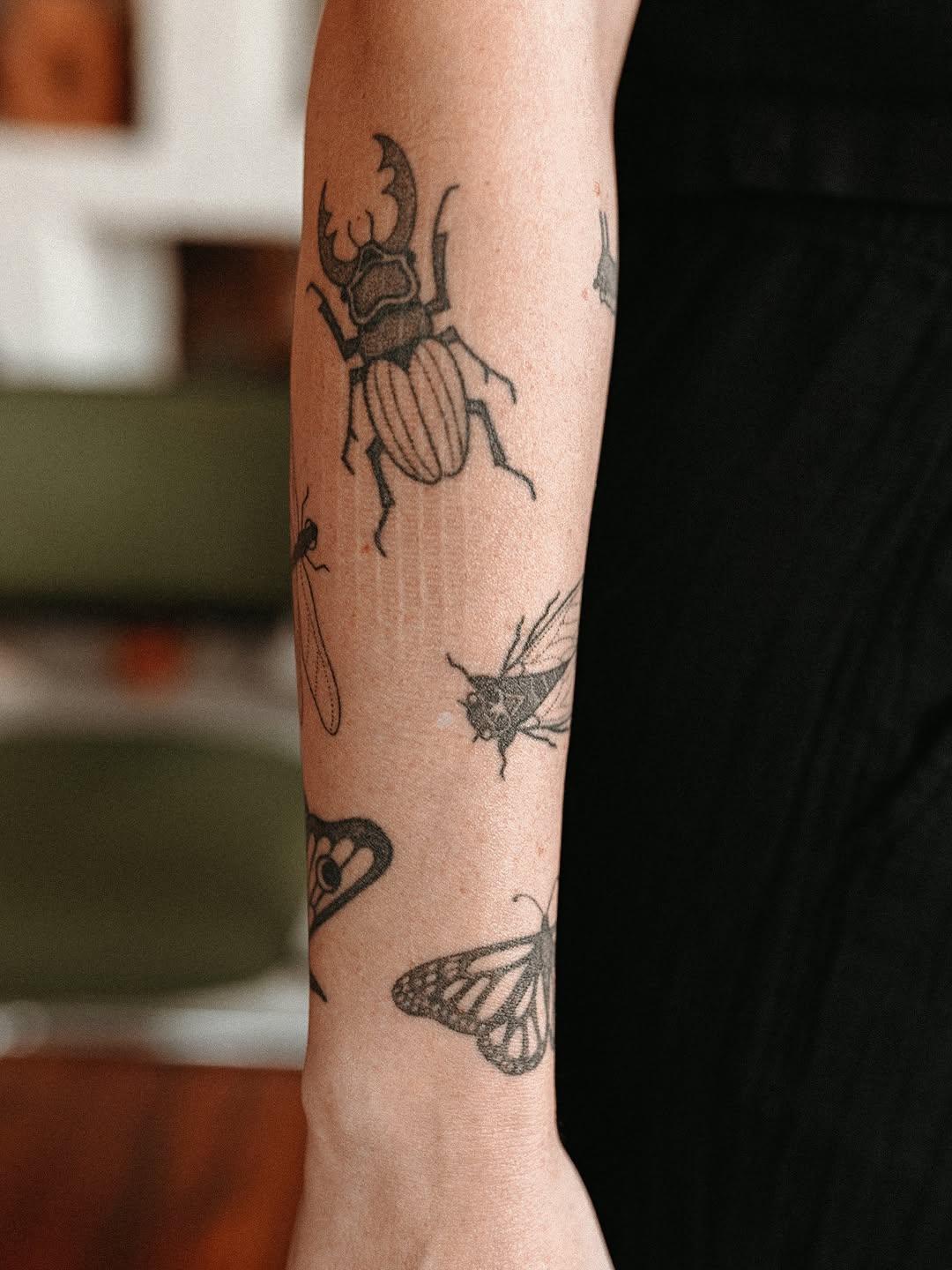 Insects and butterflies fine line tattoo on the forearm by Grace Wise - Handpoke Tattoos